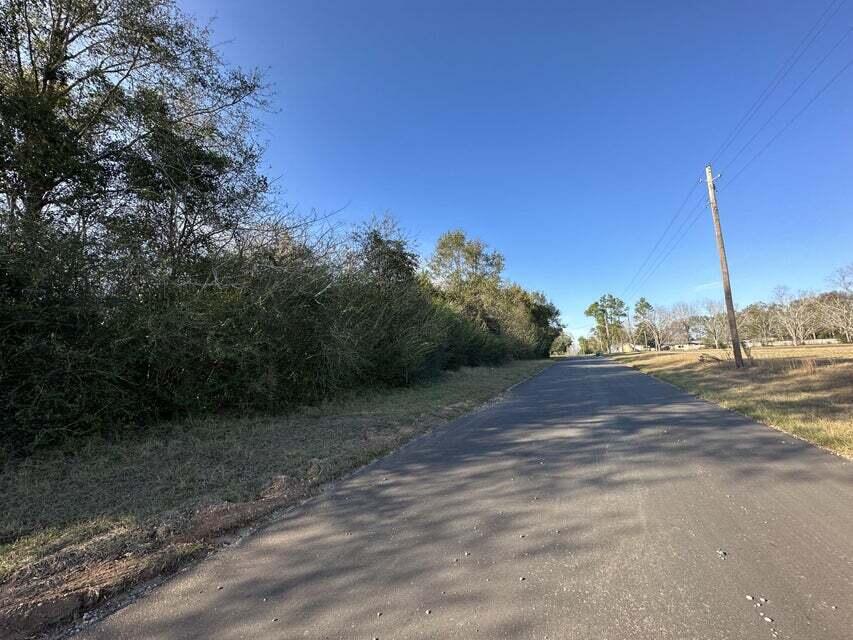 16+/- Acres In the heart of Laurel Hill.  Private country living, but with city conveniences.  
Enjoy paved roads and easy access to utilities,  With local churches, schools and businesses nearby. Bring your build plans today!