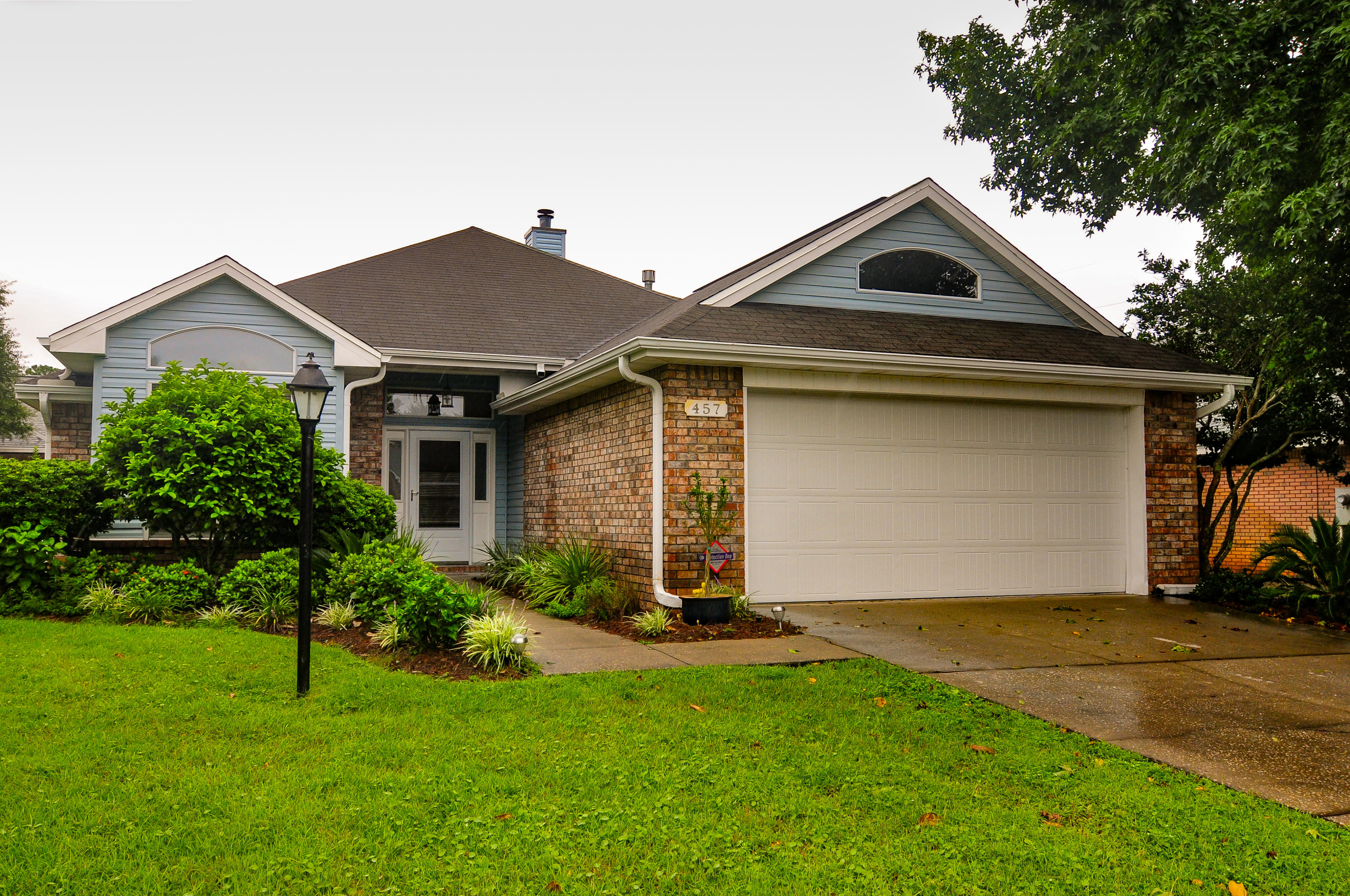 Beautiful Contemporary home in desirable Magnolia Shores Subdivision. This 3 bedroom  two full bath home has so much to offer. Turn key and ready to go, 457 Sandmore Shores provides waterviews from the front yard of the Santa Rosa Sound. Quiet street that ends in a cul-de-sac. Within 4 miles west of Hurlburt Field Air Force Base. Close to beaches and shopping. Newly painted, new carpet, new matching appliances. The entry foyer overlooks a vaulted ceiling with a great open floor plan. There is a gas fireplace for those cool winter mornings. The master bedroom is split from the other two guest bedrooms. The master bath has a separate garden tub and shower with double vanities. Lots of storage closets throughout this great property. Spacious granite counter tops in the kitchen with large stainless steel fridge, dishwasher, stove with smooth top cooking surface and built in microwave. Custom tile backsplash in the kitchen as well gives the home an elegant touch. There is a new gas water heater, there is a newer HVAC system with electric A/C and gas heat. Security system all ready in place and ready to activate. Easy care exterior with irrigation system, brick and vinyl exterior allows more time to enjoy the nice sized back yard that is privacy fenced and has a large covered patio. Two car garage with pull down stairs for storage above. This is one that needs to be on the top of your list. Schedule your showing today! Buyer to verify all data and dimensions.