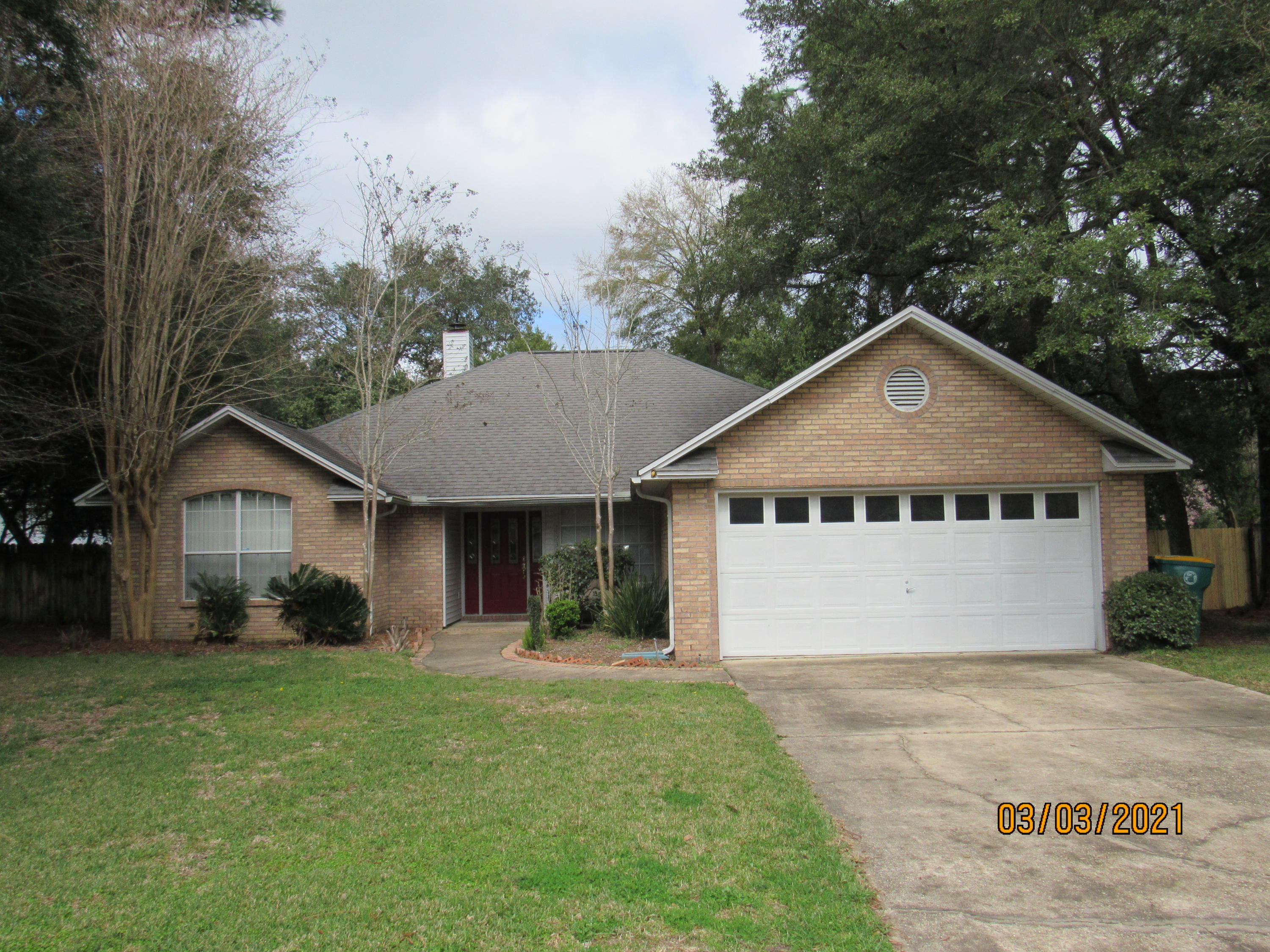 Gorgeous home nestled on a cul de sac street in the highly coveted Rocky Bayou community, this 3 bedroom, 2 bath home features an all-brick exterior, a 2-car garage, and a large, privacy-fenced back yard with a screened back porch. Interior features include cathedral ceilings, tray ceilings, arched doorways, a brick fireplace, a split floor plan, and tile flooring in the large living room. There is a formal dining room in addition to the eat-in kitchen, which has its own dining area, granite counter tops, plenty of cabinet space, a newer refrigerator, and a gas stove. The master will easily accommodate king-size furniture and a sitting area, has tray ceilings, its own exterior door to the screened porch, and an en suite with a garden tub, stand-up shower, double vanities, linen closet, and walk-in closet. The two guest rooms share a full bath as well. Laundry room off of kitchen. Pets may be considered on a case-by-case basis with prior owner approval and a nonrefundable pet fee. No smoking, including vapes.