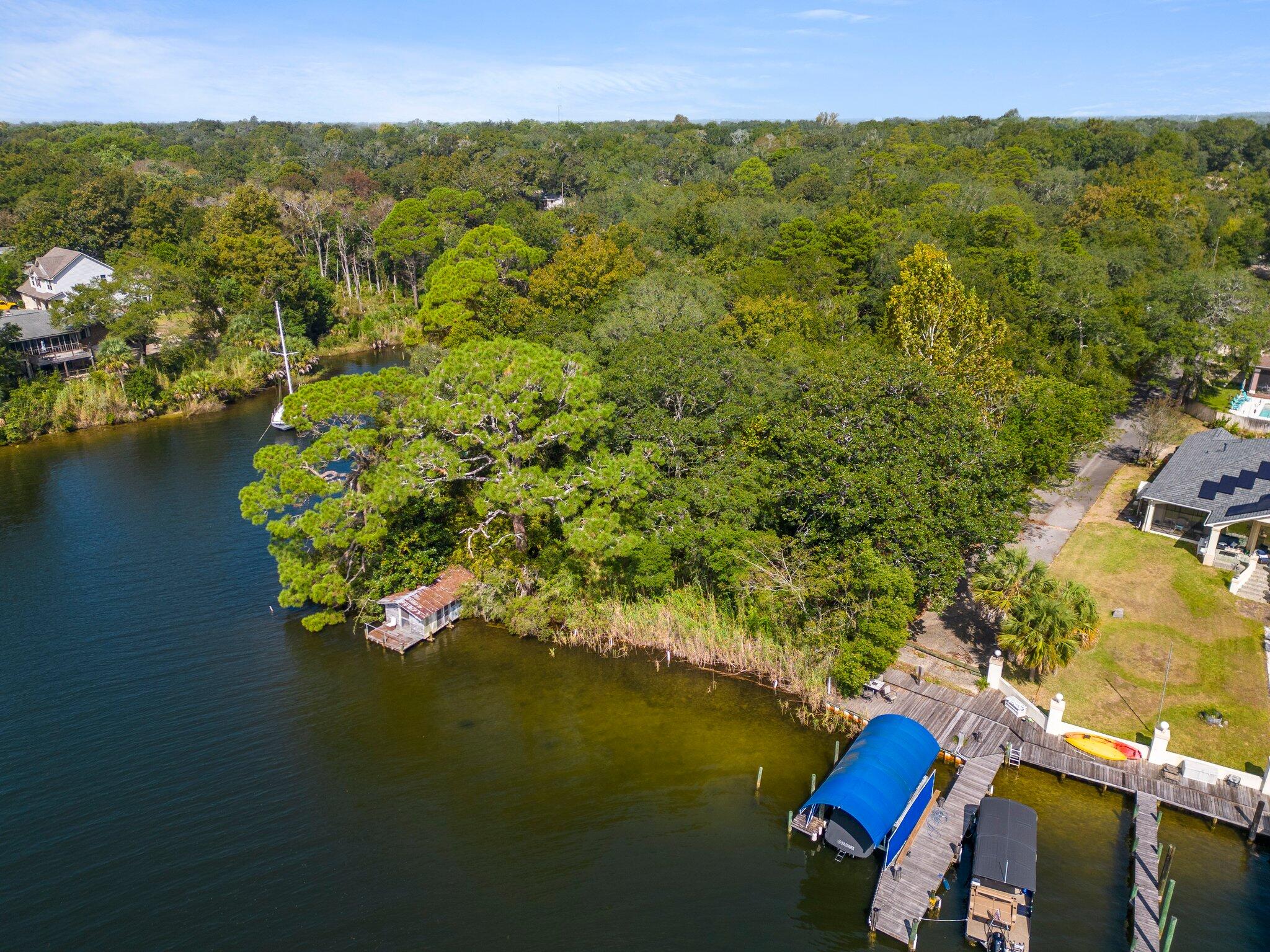 Waterfront property with so many possibilities!  Rare find in Niceville 1.3 acres with 100 feet of water access.
