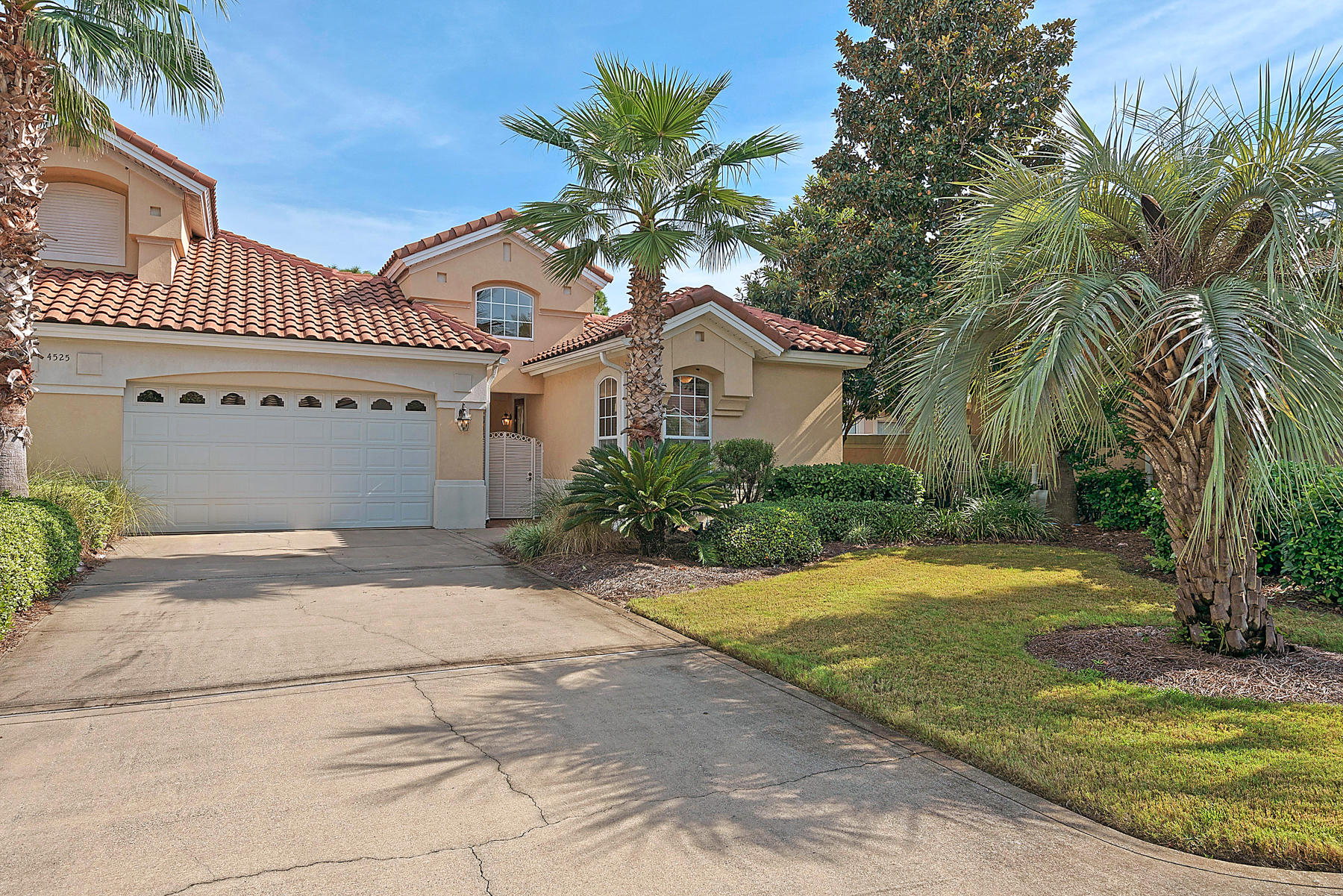Live your dream, the Destin way in Regatta Bay's prestigious Golf Villas community! This beautifully appointed 3-bedroom, 3-bath Villa with 2-bedrooms and 2-baths in the main house, split by a private courtyard, from a beautifully self-contained 1-bedroom/1-bath guest home offers resort style living in one of Destin Florida's premiere gated-guarded golf course communities. Just minutes from some of the world's most celebrated beaches, you'll revel in the luxuries of the Emerald Coast. Neighboring highlights include: Legacy Marina, renowned restaurants, shopping, movie theaters and much much more. No matter what your interests, Regatta Bay has something for everyone; be it yachting, sport-fishing, boating, biking, walking, wine tasting, beach-coming, golf or tennis, this Destin benchmark community has something for everyone.  Your spacious Mediterranean style home comes complete with all the expected features: high ceilings, an open floor plan, granite counter tops, built-in custom cherry cabinetry, GE Profile kitchen appliances, large bedrooms and over sized 2-car garage with extra overhead storage and numerous other upgrades!  Call the Laurie Hollowell Team for your private showing today!  (850) 269-1369