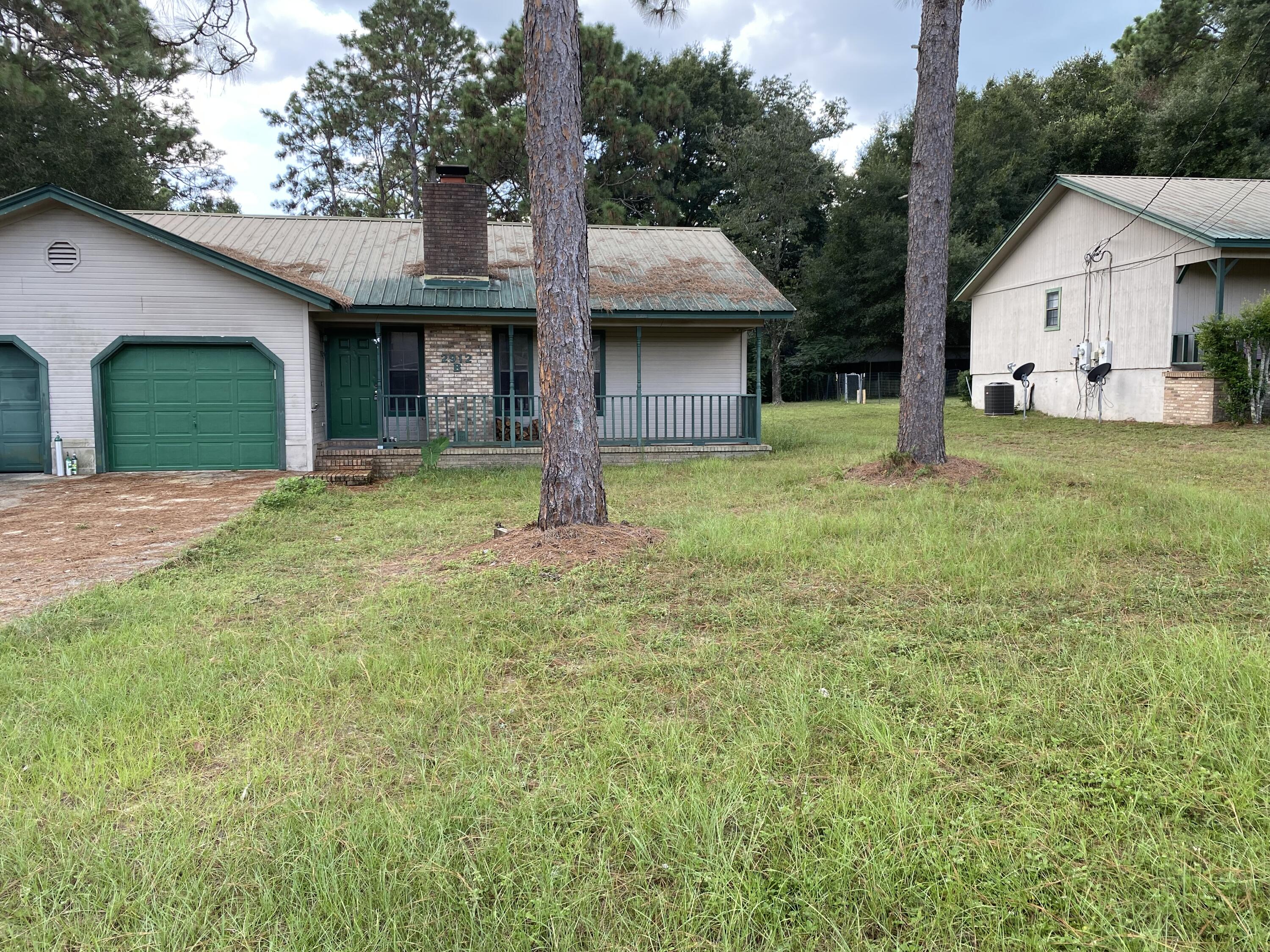 This property presents an efficient and affordable 2-bedroom, 1-bathroom residence located in the lovely northeast area of Crestview. Upon entering, you will be greeted by a cozy wood-burning fireplace, creating a warm homey atmosphere. The kitchen, conveniently situated to the left, features a full-size pantry for ample storage. To the right, you will find two well-sized bedrooms, each complete with roomy closets, separated by a full bathroom. The property also boasts a generously sized backyard and a small concrete patio, perfect for hosting gatherings with family and friends.