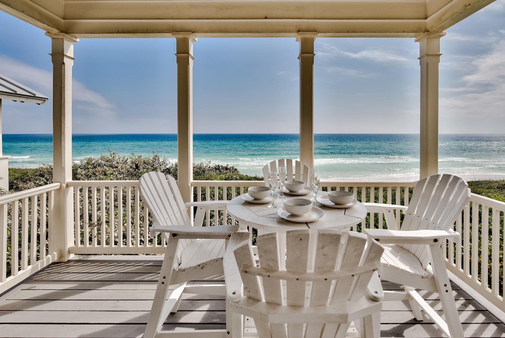 Find your piece of paradise with this rare opportunity to own gulf-front property at Seaside. 

This two-story, one bedroom plus loft, Honeymoon Cottage at Seaside is the perfect place to retreat and spend time with the ones you love. With privacy and unobstructed views of the Gulf of Mexico, this cottage is truly a world apart, yet is just steps from the shops, activities, and community of Seaside Central Square.

Days at this home are spent upstairs, where the sun-filled open-plan kitchen, dining, and living areas connect seamlessly to your covered porch overlooking the gulf. Enjoy the sea breezes in as you dine alfresco, or lounge on the chaise and listen to the surf. 

In the evening you can retire to the romantic first-floor master suite, where ... a wall of accordion doors opens onto a sheltered porch with a bench swing and soaking tub. Surrounded by trees and enclosed by plantation shutters, this porch offers a tranquil and private retreat from the world.

The home is a stellar example of coastal decor, with white cabinetry, tongue and groove walls, and bleached-wood furniture throughout. The tile floors and backsplashes continue the whitewashed wood styling to further enhance the design.

The home was recently redesigned, reconfigured, and updated, increasing the size of the kitchen and adding a sleeping loft overhead for guests or family members. 

The updated kitchen features a Wolf gas cooktop, Sub-Zero refrigerator drawers, and Fisher & Paykel dishwasher drawers. It also has a Wolf convection microwave oven, a bonus undercounter refrigerator/freezer, a farmhouse sink, and white quartz countertops.

The sleeping loft has two full-sized mattresses, and is reached by a library-style stepladder that hangs on the wall when not in use. If you need even more bed space, the living room sofabed can be pulled out as well.

The spacious master suite downstairs has a white quartz vanity and a separate spa-like shower with glass tile and beach pebble décor. There is an LG combination washer & dryer, so you can start the laundry before going to the beach, then return home to clean dry clothes.

If you are looking for rental income when you are not in residence, this home's beachfront location and proximity to the center of Seaside mean it will be very appealing to renters.

Make this dreamy cottage yours, and start making lasting memories with your loved ones!