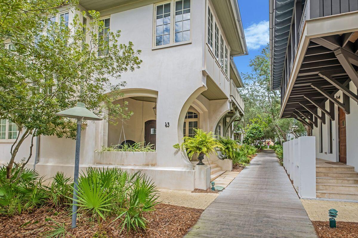43 East Water Street (aka 57 Hamilton Lane),located in the heart of Rosemary Beach is a 6 bedroom 5 bath West Indies style compound consisting of a main house and a guesthouse, substantial porches, a salt pool with water feature, landscaped yard with manicured gardens, a two car garage, a third off street parking space.  Conveniently located on an oversized corner lot, one block from Barrett Square near dining and shopping options, the amphitheater and just five blocks to the beach. Benecki Fine Homes are known for exquisite finishes, quality materials and craftsmanship and it's evident in this 3481 SF(4341 total)custom home.  Large Chef's kitchen featuring Wolf and Subzero appliances, butler's pantry, coffered ceilings, generous master suite with seating area and private balcony. Home is being offered furnished with the exception of some art and personal items.