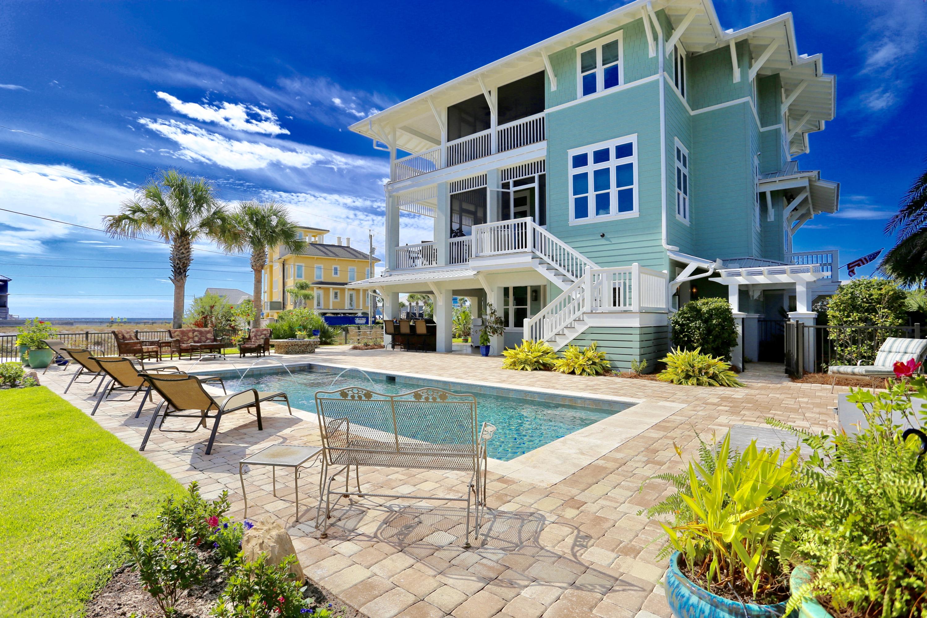 LOCATION! LOCATION! Spectacular Gulf and Oyster Lake views can be seen from every window of this luxury 3-story pool home situated on a .38 acre lot. The owners spared no expense in building this 4BR/5BA, 3900 sq.ft. home with an elevator, scored concrete on 1st floor and hardwood flooring on 2nd & 3rd floors. Enjoy open-concept living on 2nd floor with a kitchen that boasts pecky cypress cabinetry, granite countertops, 4-burner gas stove top, two electric ovens, wine fridge, trash compactor & ice maker. 9 ft. ceilings on 1st and 3rd floor and 11 ft. ceilings on 2nd floor. 9 ft. screened-in porches & open-air balconies with Brazilian (Cumaru) wood decking on the 2nd & 3rd floor. Apple electronics and sound system throughout interior and exterior living spaces. Outdoor living at its finest with outdoor kitchen that includes a commercial grade grill, refrigerator, dishwasher and garbage disposal.  You will fall in love with the 12x30 ft. saltwater pool with lights, electric cover (for the safety of your children & pets) and heated by natural gas.  Hot tub, fire pit and professionally lit landscape lighting make this outdoor entertaining area the place you will want to spend your relaxation time. First house in Walton County to have turtle glass for turtle safe lighting. Natural gas whole-house generator.  Heated and cooled workshop/man-cave/golf cart area.  Oversize carports big enough to accommodate an RV. Hurricane proof (150mph) windows and doors. Home designed by Architect Tyler Doin and built by Old South Homes, Andy Beano.