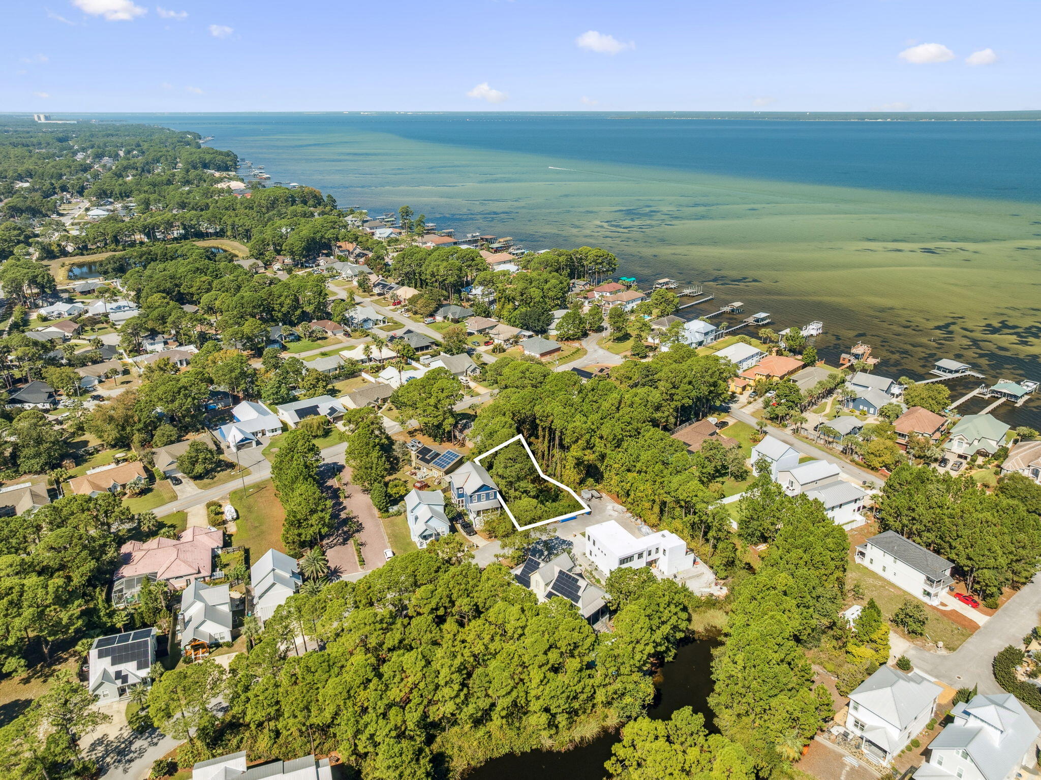 An amazing opportunity to live in a true coastal retreat! This .13-acre lot is perfectly positioned in the charming, low-density neighborhood of Bayshore Pines, just less than a mile from the beach in the heart of Miramar Beach. Enjoy a peaceful setting tucked between the bay and the Gulf, where you can truly embrace the Emerald Coast lifestyle.
The property offers exceptional privacy with no through traffic, sits in flood zone X, and comes with a current survey. Best of all, there are no HOA or new buyer fees.
You'll also love the unbeatable location—close to Silver Sands Premium Outlets, Seascape Towne Centre, and lots of great restaurant options. Enjoy nearby recreation with two exceptional parks, including one with sweeping bay views and the newly opened Paradise Park, ideal for leisurely walks or outdoor activity.
Don't miss this rare chance to craft your dream home in one of Miramar Beach's most desirable hidden-gem communities!