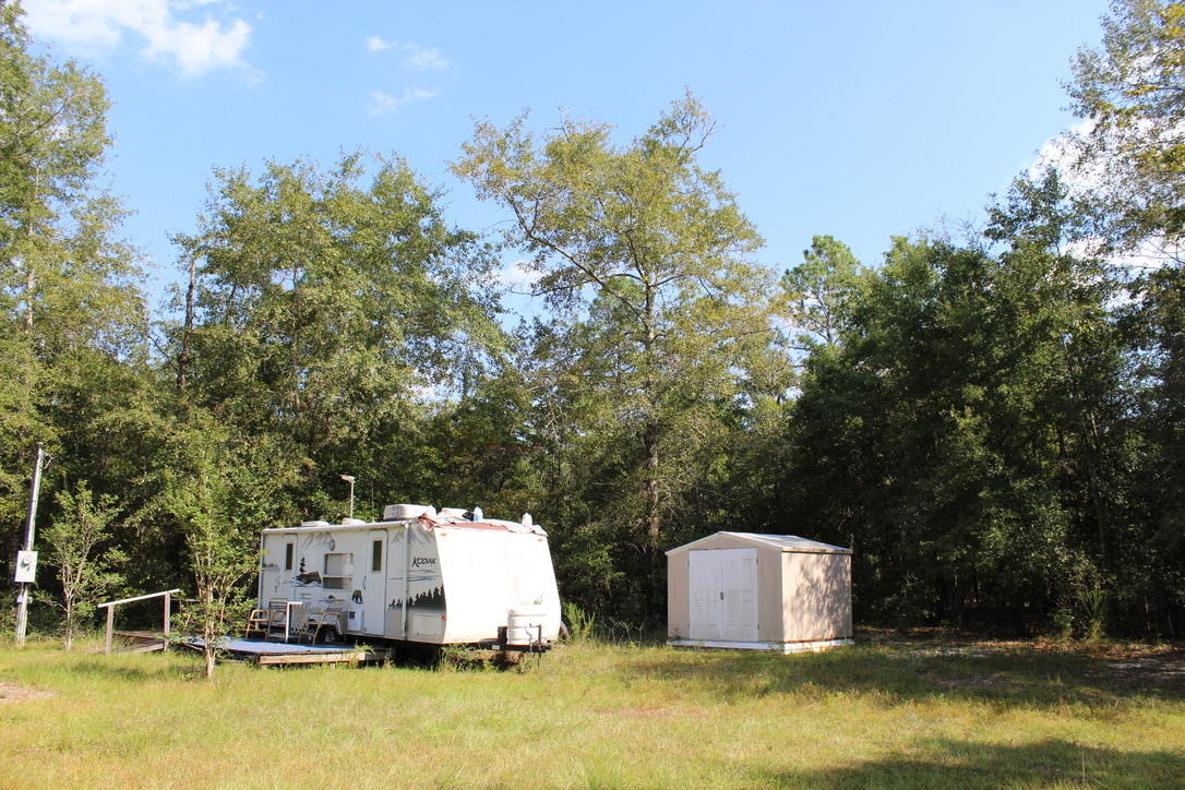 Attention hunters, campers & outdoor enthusiasts! 24 wooded acres (the subject property is surrounded by over 275 acres of natural growth timber).
Property includes a 16 foot Kodiak RV with slide out! Well, septic and electric power is hooked up and good to go! small creek runs across a corner of the property. Move in ready for camping, hunting and outdoor fun! shown by appointment. 24 hours notice required.