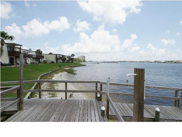 Beautifully remodeled unit. Swimming, tennis, fishing, boat slips. Kitchen was upgraded and expanded. Large Bar and Prep Area with Outlets. High End Energy Efficient Front Loading Washing Machine Built in Under Counter and Built In Under Counter Dryer. Ceiling Fans in kitchen, dining room, living room and master bedroom. Extra large deep sink. Ironing board built in. Sound Front Swimming Pool. Lighted Tennis Court. Club House available for your parties and gatherings with kitchen, billiards, television, and pool access. Boat and Fishing Dock. Boat slips available on first come basis. Owner pays water, sewer and trash. Owner is licensed real estate agent. Condo Association will not allow tenant pets.