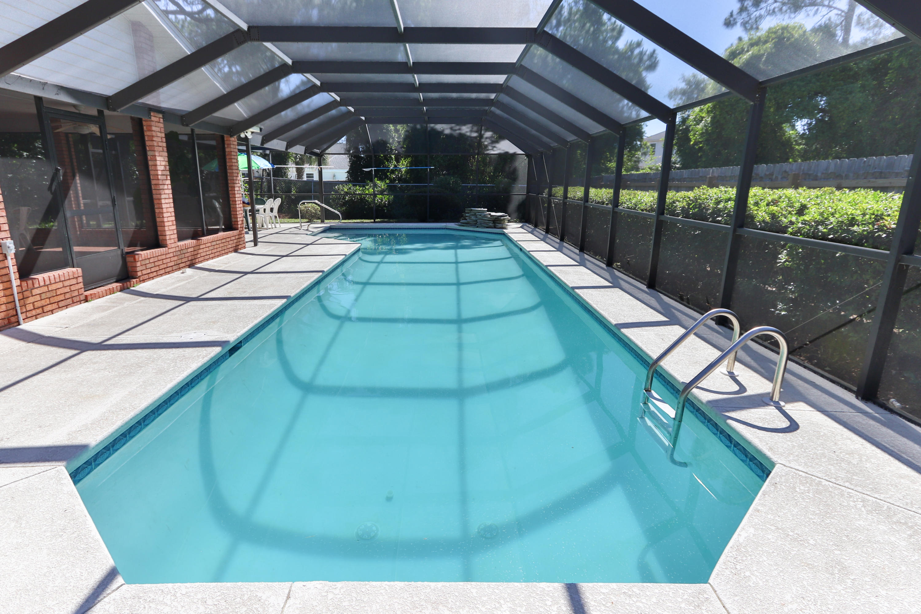 Great location in Destin with a massive enclosed pool area, fire pit, outdoor living room, and outdoor dining room!!! Welcome to Florida living and fun in the sun. This home was made for entertaining. 867 Kell-Aire Drive is a spacious home situated on a large lot with mature landscaping in the community of Kell-Aire Gardens. The home offers 3 bedrooms, 2 full bathrooms along with an office/flex/4th bedroom next to the private half bath. Spacious living room with gas fireplace and vaulted ceilings. Large formal family dining room open to the kitchen. Kitchen features a large island and breakfast area overlooking the pool. All new kitchen appliances too! This home has some cool upgrades! The property has a heated salt water pool powered by solar panels ,800 sf screened-in lanai for outdoor coastal dining, 1,250sf screened-in pool area with water fall,  built in generator for hurricanes and a heated garage! Sprinkler system for the large private yard. This charming family home is located in the heart of Destin just minutes from the white sandy beaches and shimmering emerald waters of the Gulf of Mexico as well as shopping, coastal cuisine and many local attractions. Must see and be ready to start living your florida dream life. Great place to quarantine!