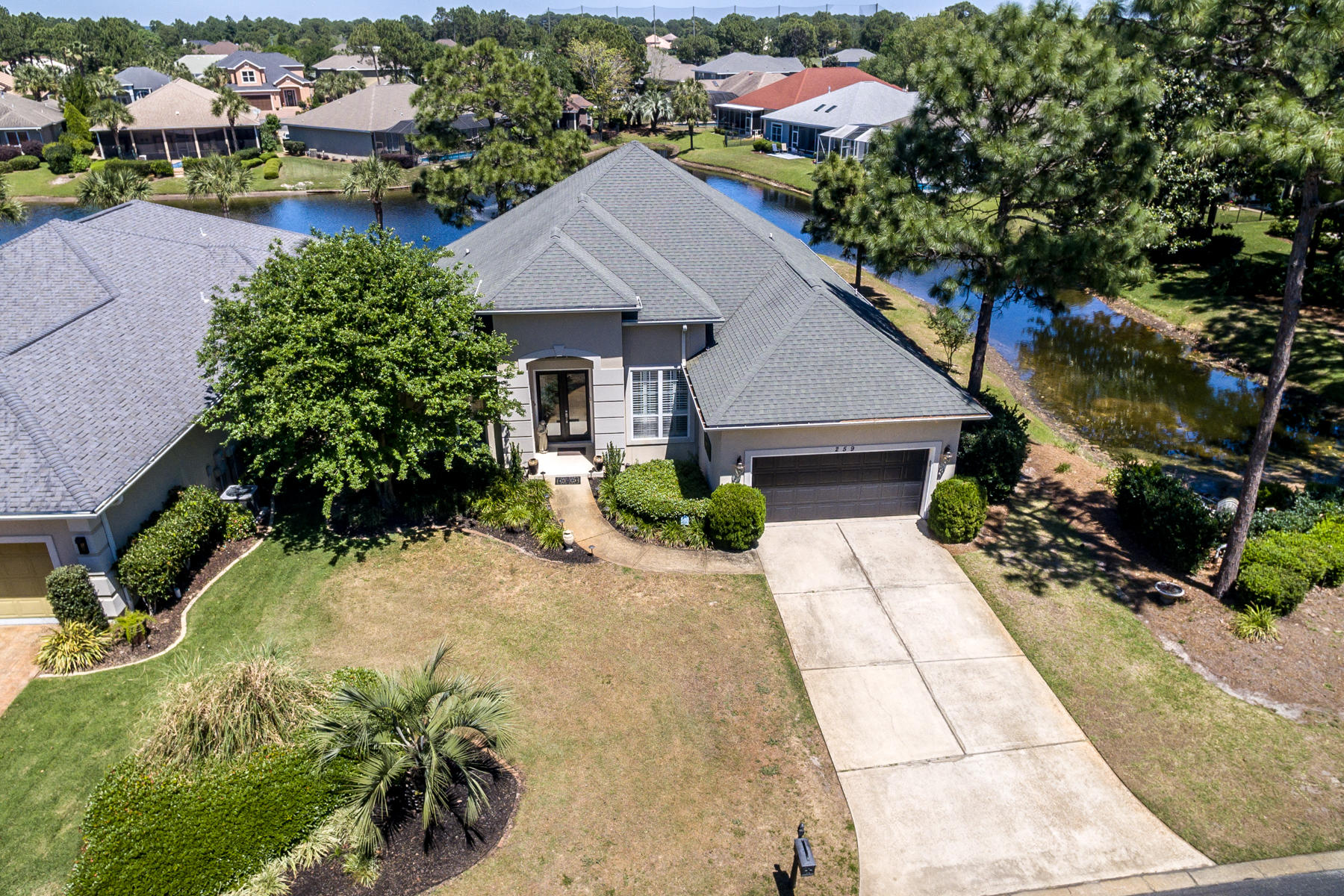 Custom-built, lakefront home in Emerald Lakes is meticulously maintained and well equipped. Emerald Lakes is an idyllic, peaceful community interspersed with lush orange and lemon trees and deluxe amenities including a gated entrance, community pool, tennis, and basketball. This lot is especially private and serene with lake frontage on two sides of the home. This 3-bedroom, one-level home features a dedicated office, screened-in porch, ten-ft ceilings, bullnose corners, tile floors, fenced-in backyard, and up-to-date kitchen and baths. Views of the lake flow peacefully throughout the interior. The master suite includes a sitting area, outdoor access, jetted tub, and sizable walk-in closet. Emerald Lakes is located off of Hwy 98 across the street from the upscale, open air City Market.