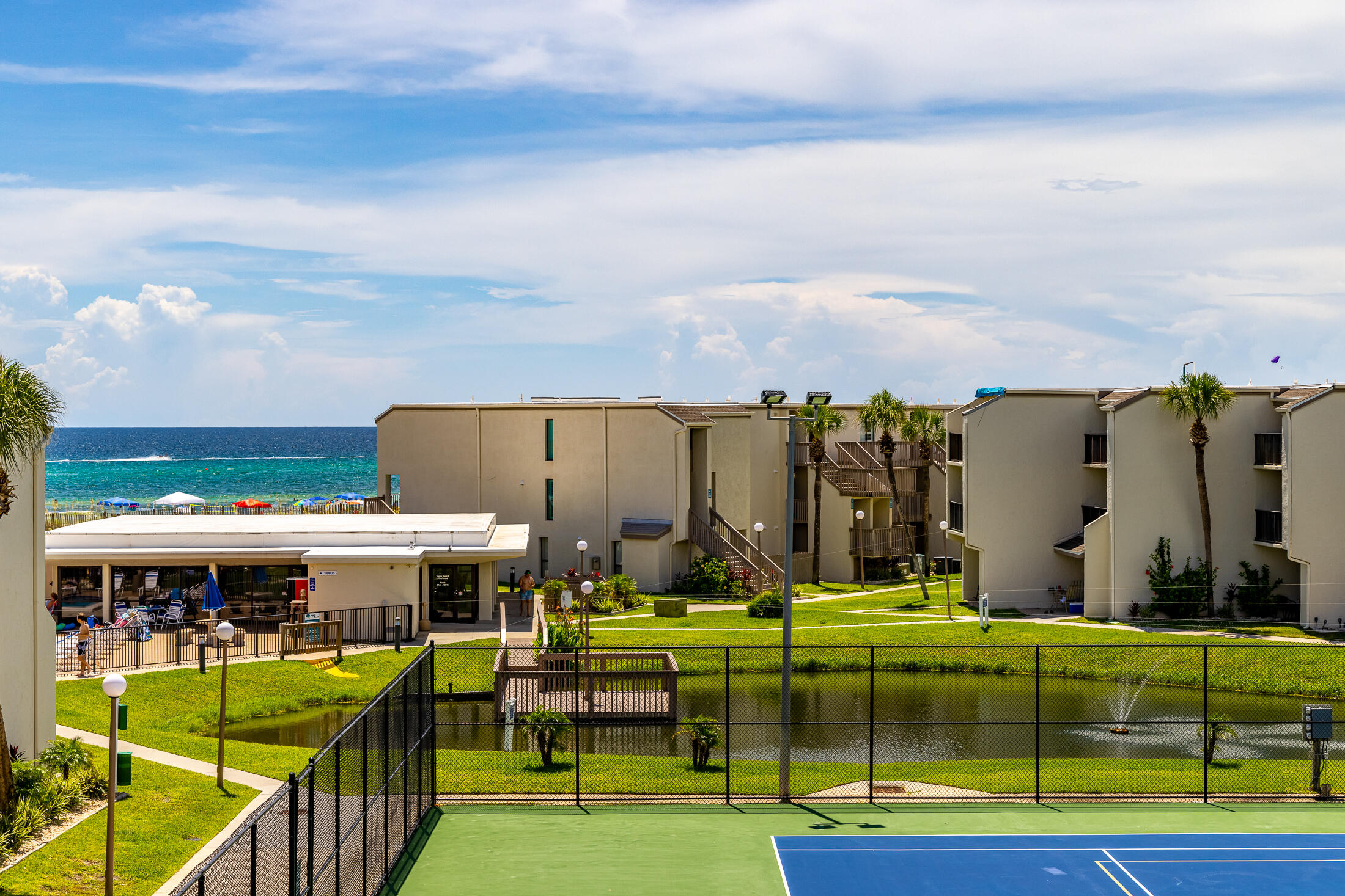 UNBELIEVABLE NEW PRICE!!! This is an investors DREAM! Lowest priced per sq/ft 4 bedroom/3 bath Gulf View Condo in the entire PCB area!!!

New luxury (LVP) flooring, new furniture in the dining and living room, new toilet fixtures, new hot water heater, and the entire unit is newly painted.

The sunset views from the 2nd and 3rd floor balconies are absolutely breathtaking. This amazing condo has been incredibly well cared for/maintained - and it shows the moment you walk in the door!

Being sold fully furnished, turnkey ready with bookings through August. With projected rental incomes of $80k+, make a great return on your investment starting day #1!!! Sugar Beach has everything you could ask for to ensure enormous rental income. It is one of the few remaining pet friendly vacation destinations in PCB - which is a HUGE amenity for renters (giving you a truly competitive advantage). Gated community, no elevators, park directly at your door, private gated beach access, pool, tennis, shuffleboard, grilling area, huge koi/turtle pond right out your back door, countless nearby restaurants/activities, and the list goes on!

Banks offer less than a 1% ROI, and stocks and crypto values have been declining. Enjoy a projected 12% annual ROI with this amazing investment opportunity!

Welcome home to Paradise!!!

*Low quarterly HOA Fees include water, trash, cable, exterior insurance, grounds keeping, 24 hour video surveillance, community amenities (pool, tennis court x 2, shuffleboard, Koi pond, community room/kitchen, ping pong), on site maintenance 8 hours daily, onsite property management Mon-Fri, and private gated beach access.