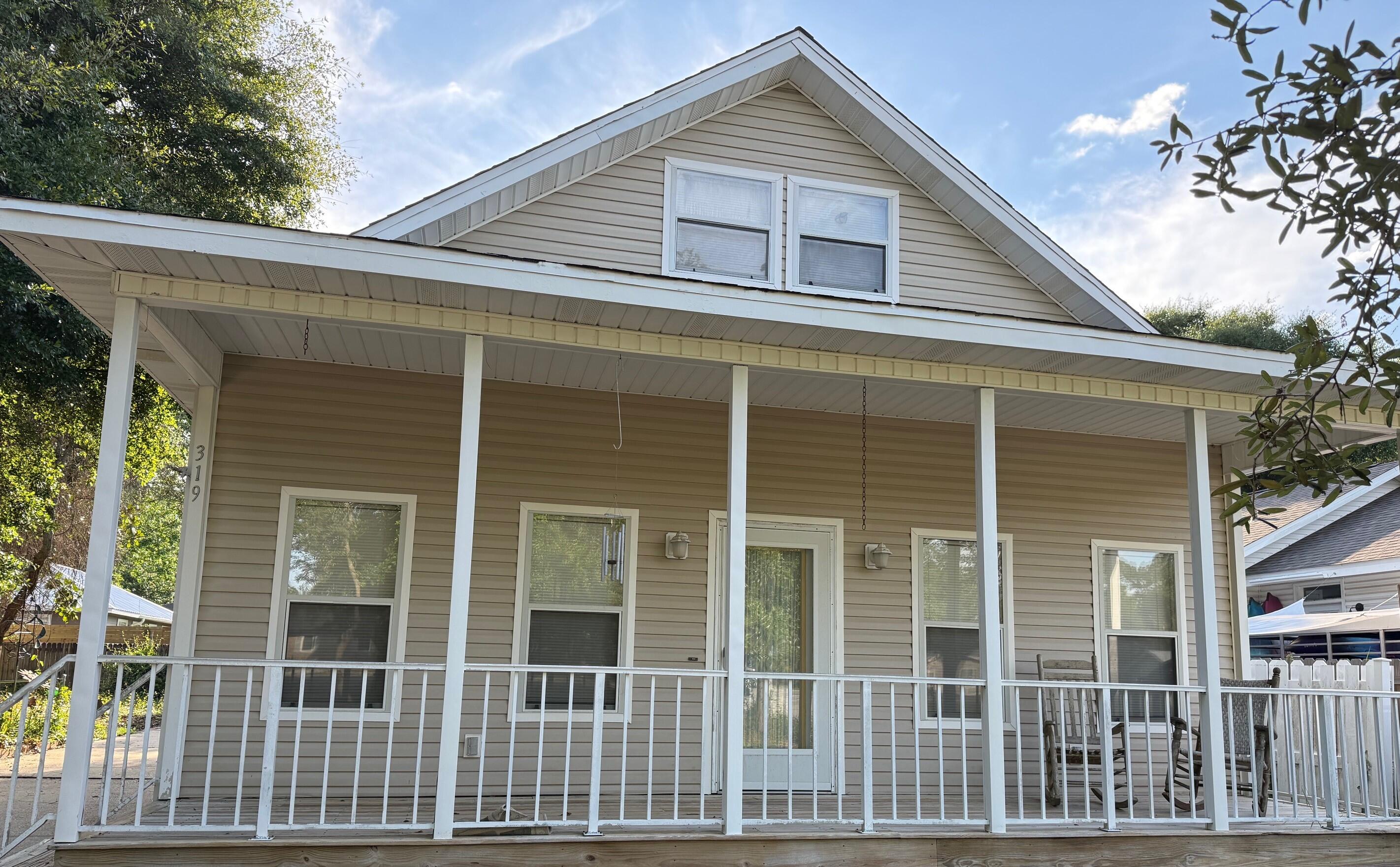 Charming Florida cottage in the very heart of Downtown Destin, featuring a full front porch (nice for rocking chairs and watching the world go by!), a screened in back porch, and the perfect size back yard for barbeques or  gardening enthusiasts. The first level has two bdrms with ensuite bathrooms, cozy living rm, kitchen, dining area, & laundry rm. Upstairs is the 3rd bdrm, bath,& sitting room. Ample storage areas upstairs w/easy attic access. The property location is so convenient to numerous shopping areas ,restaurants, the New Publix, beaches, churches, and other area attractions! Great property for new buyers, families, or savy investors.  There is also a vacant lot next door which can be purchased together with this home or separately.... creating numerous investment opportunities.