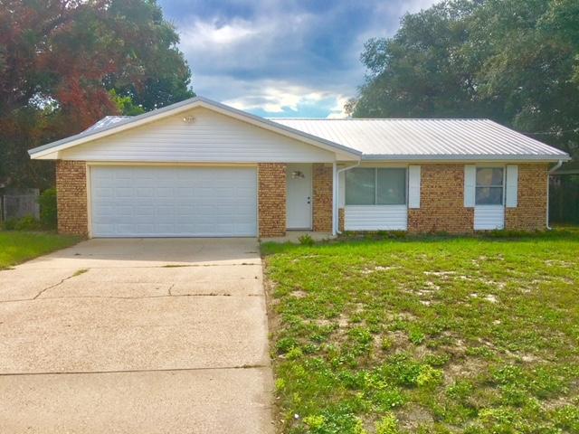 Nice remodeled 1 story home in Shalimar for under $230K! Brick front, vinyl siding & metal roof for easy maintenance. Nice wood looking tile flooring throughout & carpet in the bedrooms. Kitchen has a dining area, newer cabinets, all appliances in place (stainless steel except dishwasher) & a pantry. Inside utility closet off the kitchen - washer & dryer convey. All electric! Home also features an oversized 2 car garage w/ shelving, auto garage door opener, a partially covered back patio, large fenced backyard, brand new lawn pump, sprinkler system & a yard building/extra storage. Close to bases, schools, shopping, hospitals, restaurants, etc. NOTE: Home re-wired from aluminum to copper = 6/2015 (w/ Emerald Shores Electric), ROOF = 6/2015 (w/ Xtreme Roofing), HVAC = 10/2012, WH = 01/1996.