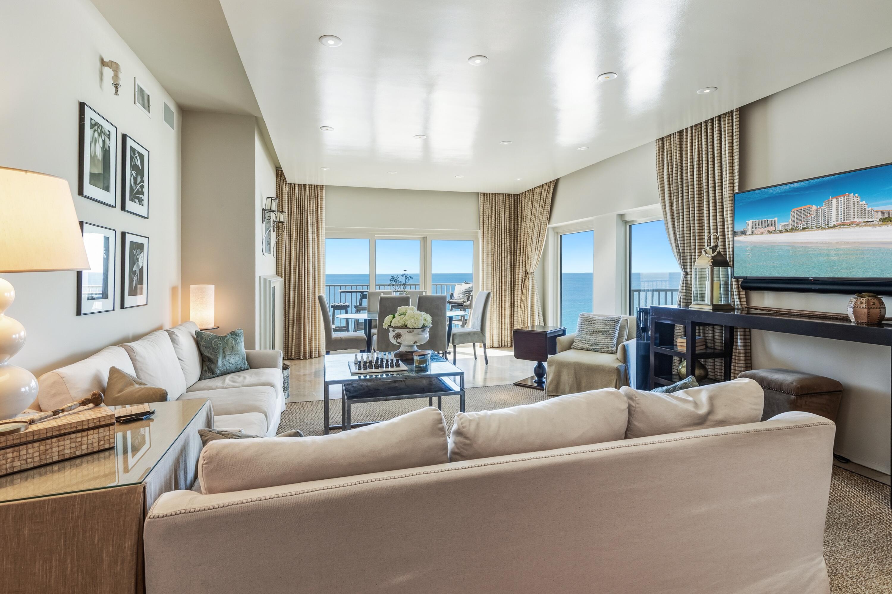 Architecturally significant Gulf-front penthouse at Tops'l Beach & Racquet Resort, completely rebuilt and reimagined by acclaimed architect Bobby McAlpine and curated by award-winning interior designer Ashley Gilbreath. Positioned on the 13th floor, this rare penthouse-level residence offers sweeping 180-degree panoramic views of the Gulf and the protected natural landscape of Tops'l Hill Preserve State Park, with unobstructed sunrise and sunset vistas.
The interior reflects a refined coastal aesthetic with marble countertops, custom cabinetry throughout, a Sub-Zero refrigerator with ice maker, and two private balconies that create seamless indoor-outdoor living while capturing the expansive views. With only four residences on the penthouse level, the property provides exceptional privacy, quiet hallways, and an exclusive atmosphere.
Each bedroom has been thoughtfully designed to deliver comfort, functionality, and a true "home at the beach" experience, suitable for full-time residence, a second home, or a luxury vacation retreat.
Located within the gated, 52-acre Tops'l Beach & Racquet Resort, residents and guests enjoy direct beach access and a comprehensive suite of resort amenities, including multiple pools with heated indoor and outdoor options, a lagoon-style pool, and hot tubs. The award-winning Tops'l Tennis Center features twelve lighted clay courts, while the Club & Fitness Center offers racquetball and basketball courts, sauna and steam rooms, fitness classes, and massage services.
On-site dining includes Blue Dunes Grille, Club Tiki, and the Ocean Club restaurant. Conveniently situated near shopping, dining, and entertainment along Scenic Highway 98. This distinguished penthouse offers a rare combination of architectural pedigree, unobstructed Gulf and preserve views, and access to one of Miramar Beach's most established luxury resort communities.