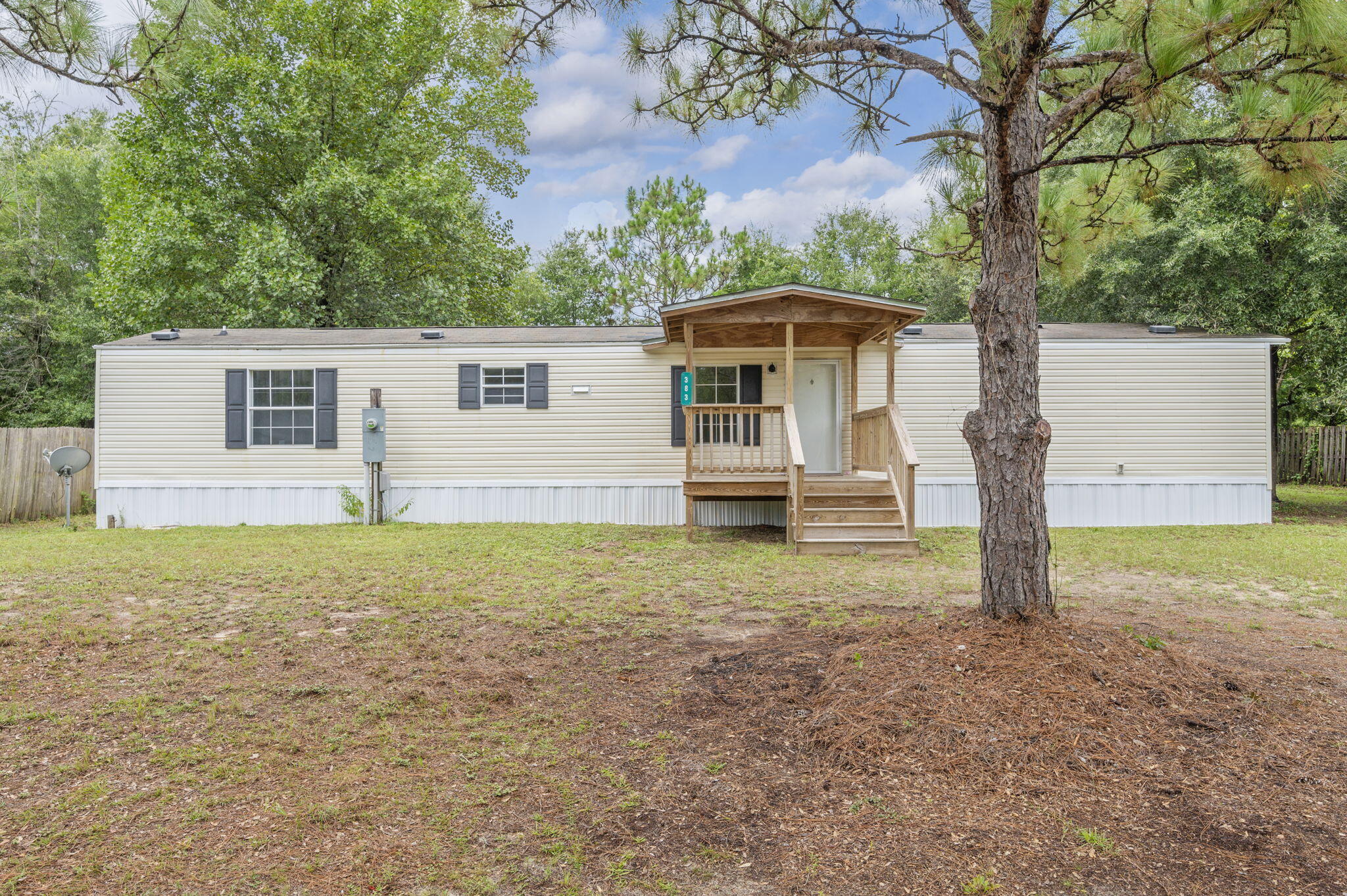 This 3-bedroom, 2-bathroom 2011 single-wide mobile home is nestled on over a third of an acre and features both a covered front and back deck perfect for morning coffee, weekend BBQs, or simply relaxing outdoors. The fenced backyard is great for pets, kids, or a little extra peace of mind. Inside, you'll find a functional split-bedroom floor plan with comfortable living spaces. The large lot offers room to play, garden, or expandâ'giving you flexibility to make it your own.
Whether you're starting out, slowing down, or looking for a smart investment, this property delivers space, charm, and value.