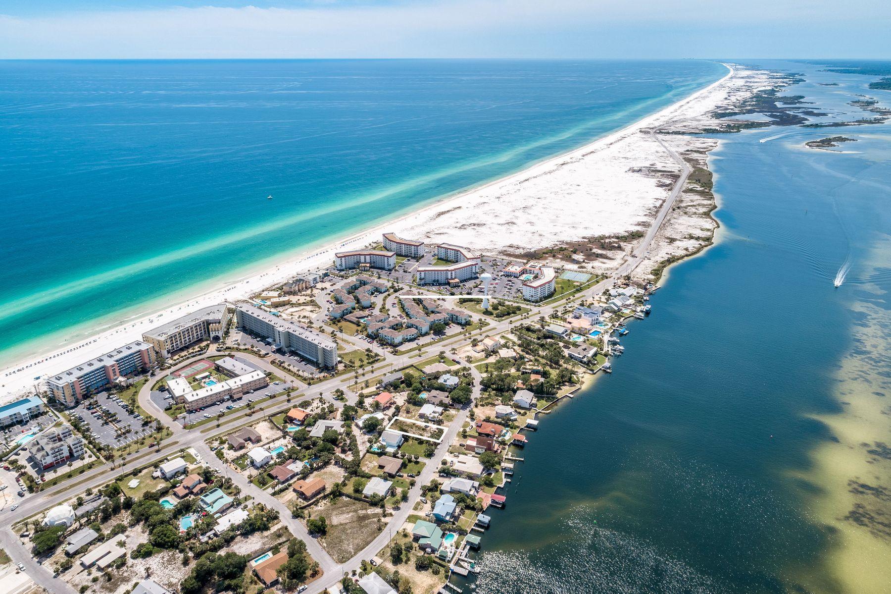 Transform your dream of owning a beach home into reality with this quarter-acre lot located on Tarpon Drive on Okaloosa Island. Located across the street from the Intracoastal Waterway, this large homesite offers convenient beach access across Santa Rosa Boulevard and close proximity to a variety of restaurants and recreational activities. Build your own beach retreat with your personal aesthetic, preferences and lifestyle in mind. Okaloosa Island is a quiet, narrow, three-mile island nestled between Fort Walton Beach and Destin. Bordered by both Choctawhatchee Bay and the Gulf of Mexico, it boasts numerous public beach accesses and parks in addition to well-loved community amenities including a boardwalk, 1,262-ft. fishing pier and the Gulfarium Marine Adventure Park.