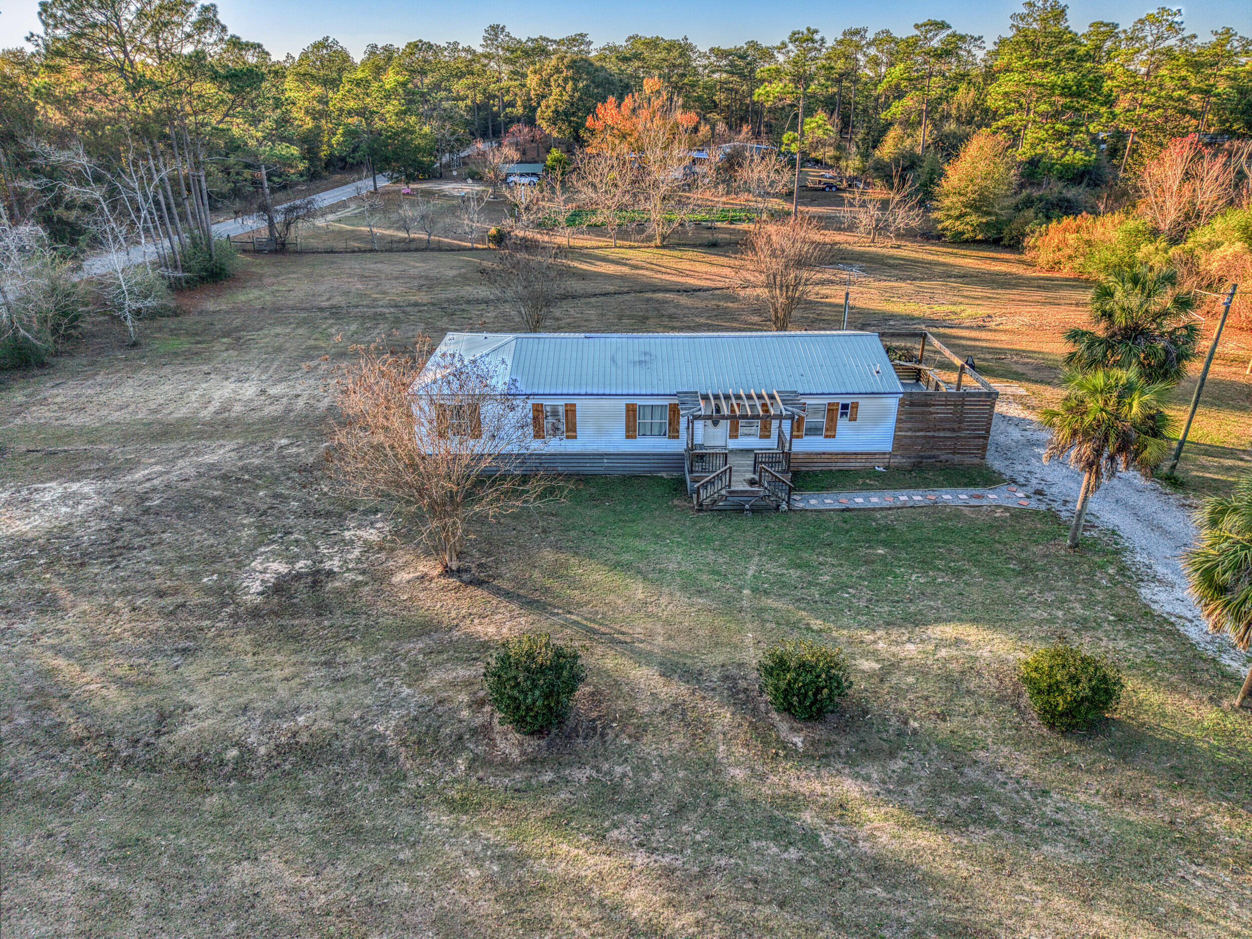 Spacious Country Living with No HOA!
Welcome to 2841 Kings Lake Rd in DeFuniak Springs — a well-situated 5-bedroom, 2-bath home offering 1,620 square feet of comfortable living space on a generous 1.2-acre lot. This property features NEW PLUMBING underneath, a split floor plan, providing privacy and flexibility for families, guests, or home office needs.

Enjoy the freedom of no HOA and plenty of room to spread out, with two open-air porches perfect for relaxing, entertaining, or enjoying peaceful rural views. The property also includes a pole barn with an attached shed, ideal for equipment, storage, or workshop use, as well as a chicken coop for those looking to embrace a homestead lifestyle.

With ample outdoor space, versatile structures, and a quiet country setting just a short drive from DeFuniak Springs amenities, this property offers the perfect blend of privacy, functionality, and convenience. *UPON A SUCCESSFUL CLOSING, SELLER IS OFFERING a $10K CREDIT towards renovations or whatever the buyer would like.*
Whether you're looking for a primary residence, multi-bedroom setup, or space to live and work, this one checks all the boxes, so schedule your private showing today! 

All information in the MLS is deemed accurate, but cannot be guaranteed; buyer to perform their own due diligence.