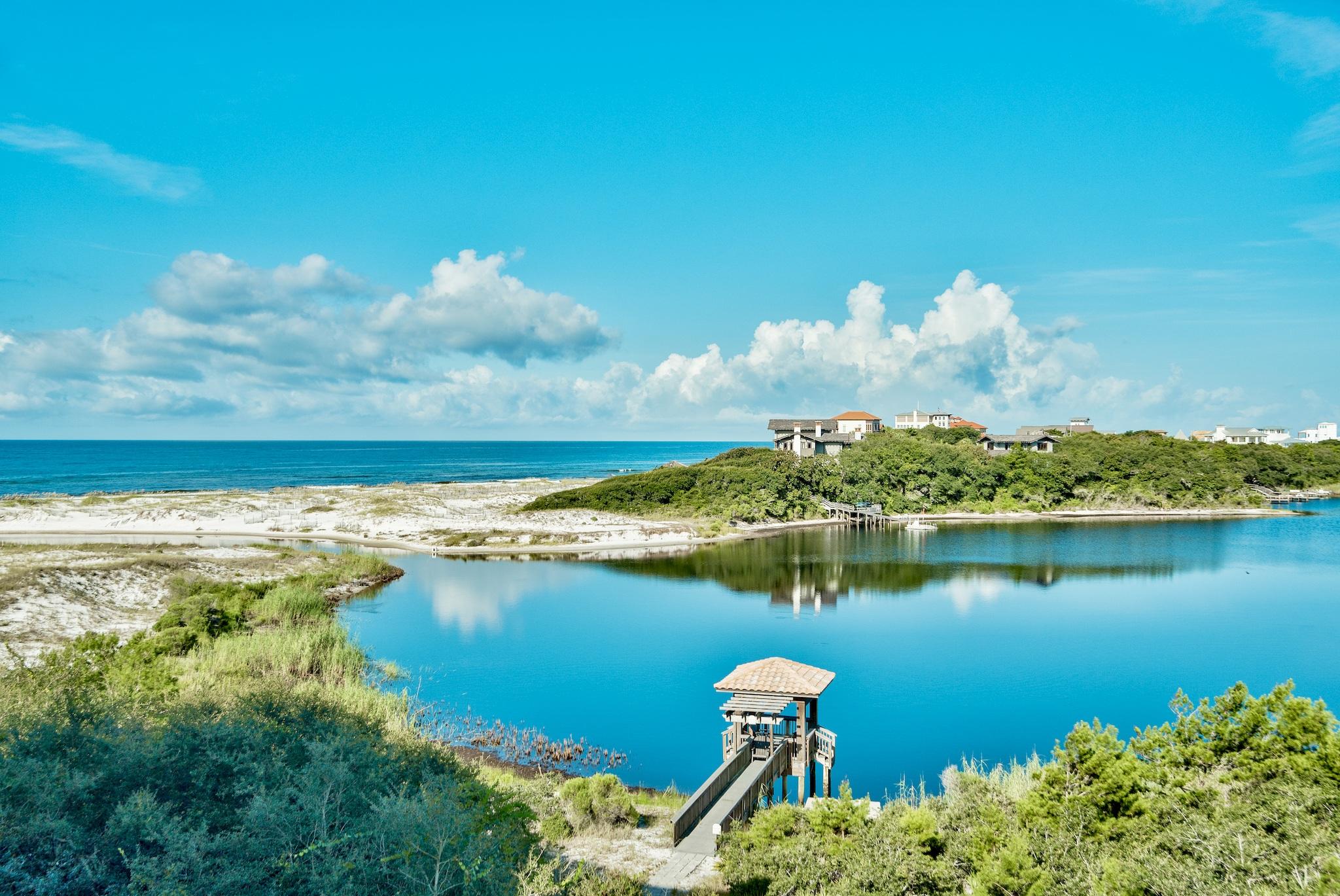 Amazing opportunity to own this top floor two level luxury condominium residence in Sanctuary by the Sea with Gulf & Lake views! This home is priced to sell and is offered fully furnished. This third floor unit offers remarkable westerly views of Big Red Fish Lake and the Gulf of Mexico. This 4 bedroom 4.5 bath two story home has two master bedrooms. The first floor offers one master off of the waterfront balcony and two additional bedrooms with private baths, laundry room, hall bath, open living and dining area with a gourmet kitchen, granite counter tops, custom cabinetry, and a 10' x 38' covered balcony. The second large master bedroom (800 sq ft)is located on the second level with a massive 22' x 38' balcony boasting a forever western view of Big Red Fish Lake & the Gulf of Mexico. Sanctuary by the Sea offers an unmatched coastal lifestyle with Beach and Coastal Dune Lake frontage, three  community pools, covered parking, fitness center and gated entry all located on the South side of Highway 30A between Blue Mountain Beach and Grayton Beach and walking distance to local shops and restaurant.  SBTS offers a haven of serenity and privacy unequaled with only 82 condominium residences on 23 secluded acres nestled by over 1,500 ft of frontage on Big Red Fish Lake and fronting 650 feet on the Gulf of Mexico.  Within  the Mediterranean style stucco exterior, luxury is a standard; every residential unit offers 10' ceilings, wide crown molding & 7'' baseboards, 8' doors, gas fireplace, wet bar, tiled balconies, travertine tile in dining, living, baths & laundry. This lush private setting with a poolside waterfall is complemented by diverse amenities including underground parking, 4X10 storage cages, three sparkling pools, gas fire pits, poolside grills, fitness center, lakeside canoeing, movie theater, video game area, owners lounge and virtual golf.