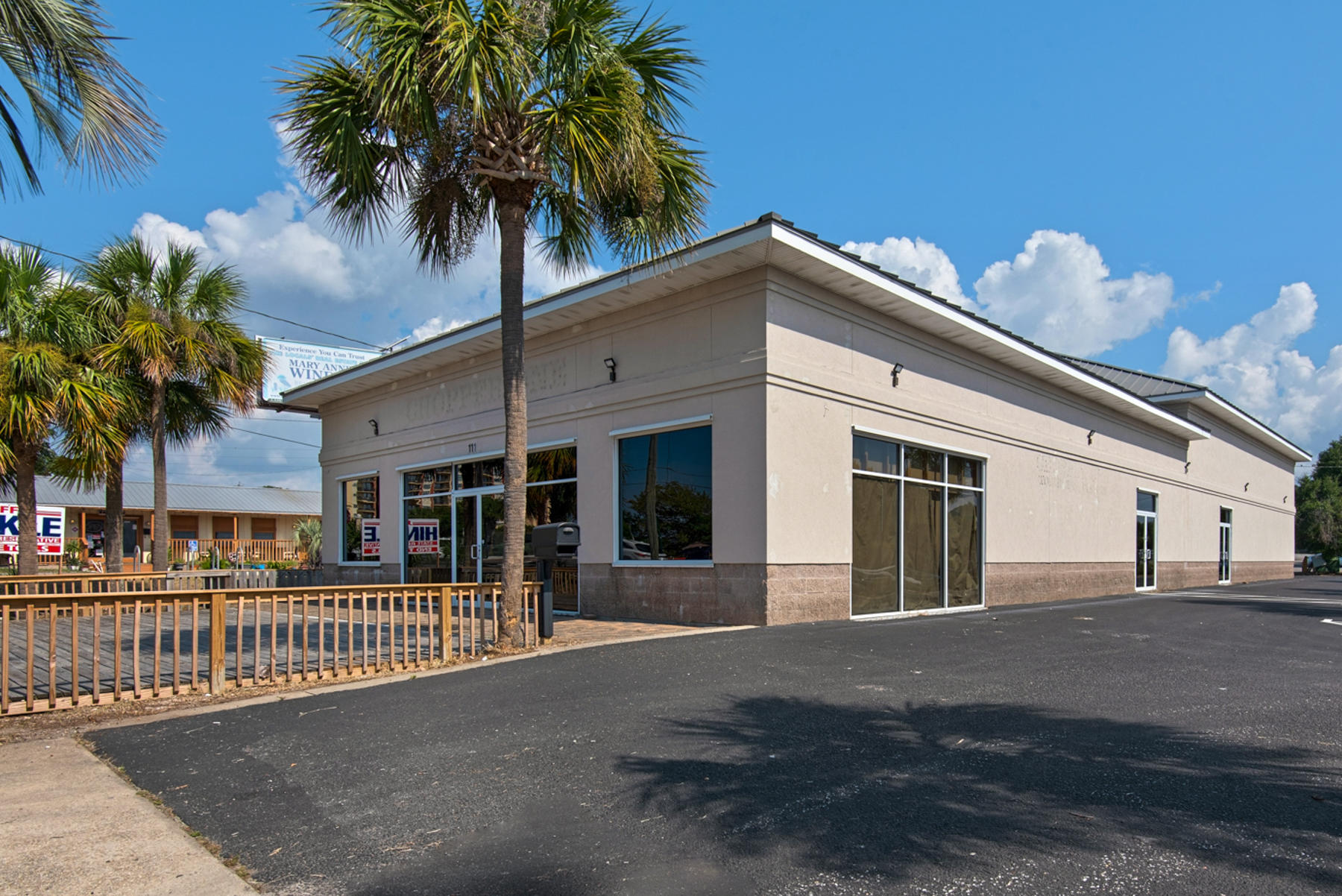 Premier Retail Opportunity! Recently had over $200K in inside improvements. Zoned as ''North Harbor Mixed Use'' which offers business options galore. Located across from AJ's/ Harbor Walk, and  Emerald Grande. 81 frontage feet on Hwy 98 (Harbor Blvd) with traffic counts in excess of 54,000. Entrance access from the East and West sides of Hwy 98. Building contains 6,850 sq ft, approx 4,605 sq ft heated and cooled. Rear garage enters into  2245 sq ft Warehouse. Extra features include Slatwall Panels, 8,615 sq ft of recently resurfaced asphalt & heavily lit parking lot. Almost 1000 ft deck on front entrance. Built like a fortress, concrete block with hard coat stucco. Corrugated metal ceiling. Commercial metal roof.  NEW A/C's, Security System & Hurricane  Shutters.