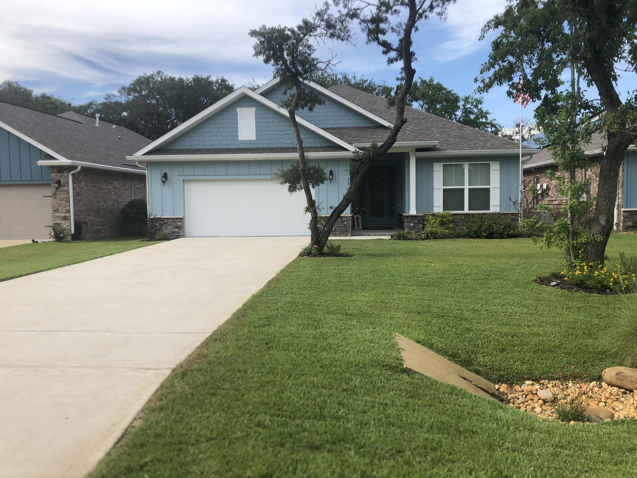 This beautiful home is centrally located in Shalimar perfect for a growing family. Home was built in 2018 it features 10' ceilings, wood like tile in all areas except the bedrooms. Kitchen features stainless steel appliances, granite countertops, custom cabinets, an oversized island, double ovens and gas cook top. As you enter home through foyer there's a guest bedroom and a bath at the front of home. Dining room and family room are spacious. Two bedrooms located at end of the house that share a bathroom. The master bedroom is spacious and the master bathroom features double sink vanities, walk-in tile shower, a bathtub and a walk in closet. Home has a great backyard and includes a good sized Lanai perfect for entertaining.