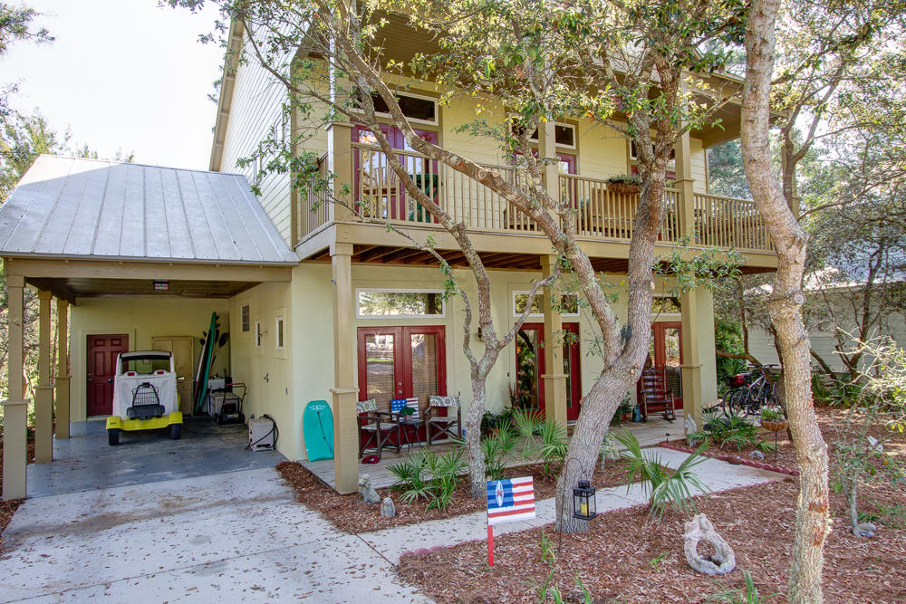 Exceptional custom home in Old Seagrove.
Room for swimming pool - see design rendering. 10 foot ceilings, Brazilian cherry floors, granite kitchen. Efficient upside down floor plan with living space up, bedrooms down. Bonus room can serve as office, den etc. New bedroom carpet and fresh interior paint in 2013. All closets built out. Entire house wired for sound & home theater, built-in speakers throughout. Pull down stairs lead to large attic storage space above carport. Boardwalk leads to creek bordering north end of lot. No HOA dues! There is simply no other home available at this price so close to the Gulf, Seaside, Publix etc.