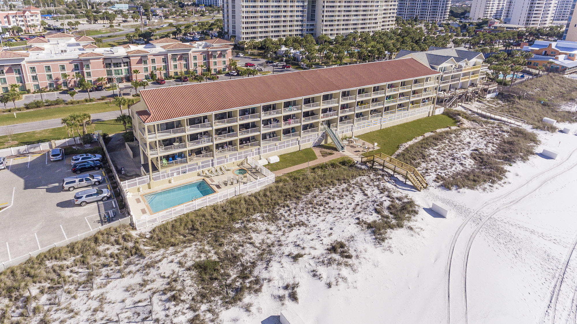 Bright and open 2-story condo on the Gulf. Seafarer Condominiums is a low-density (28 units), Gulf-front condominium community on a quiet stretch of beach near Henderson Park. This improved unit features wainscoting, recessed lighting, travertine, granite counters, stainless appliances, and an updated master bath with soaking tub and separate shower. Seafarer Condominiums features a seasonally heated pool and whirlpool, covered parking, beachside grilling, onsite rental office, and seasonal beach service. Ruth's Chris and the Back Porch are just a short stroll away.