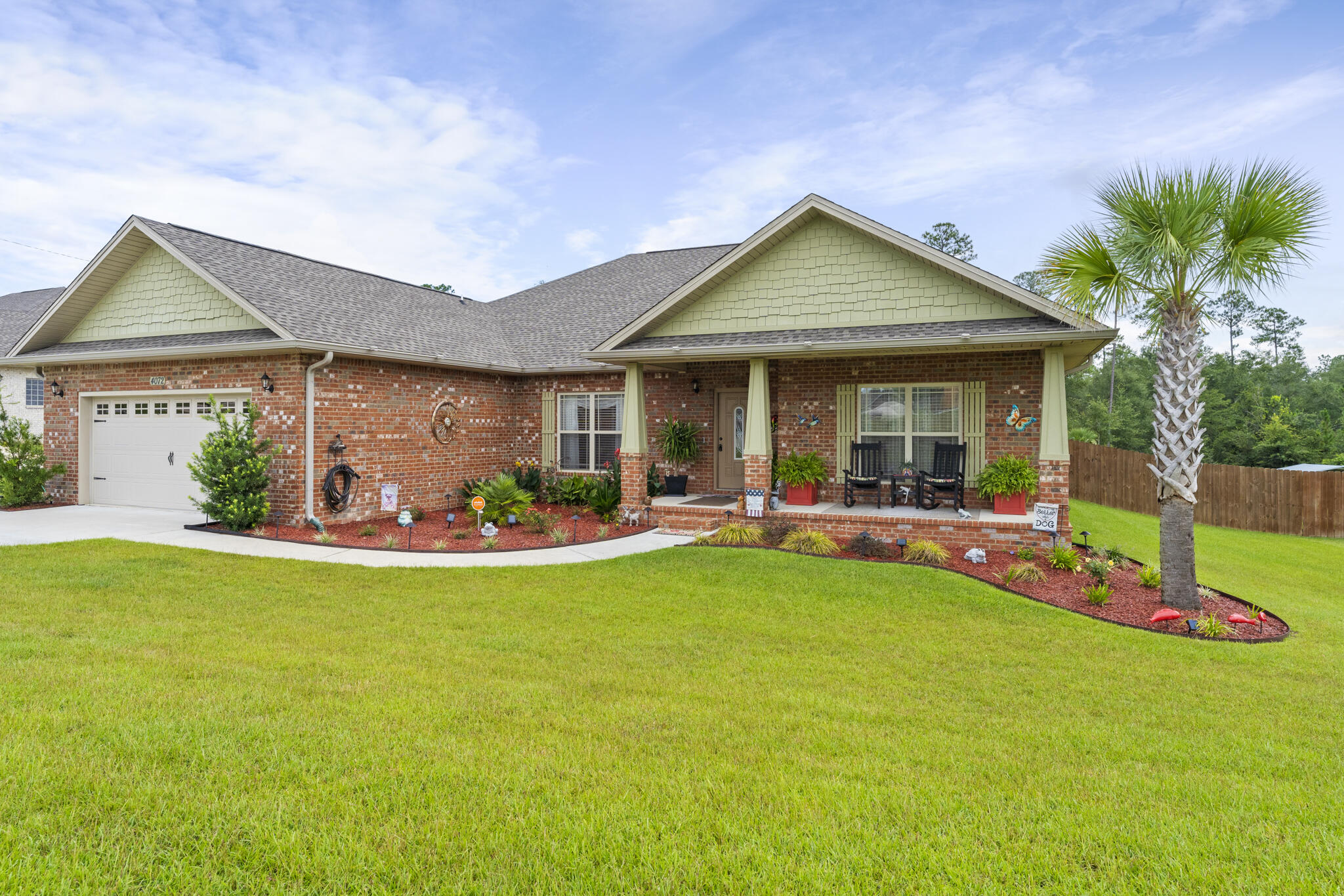 STUNNINGLY, BEAUTIFUL HOME IN CRESTVIEW! Step inside to see the entryway open onto the main living areas. The living area is framed perfectly by tray ceilings and three large windows that bring in an abundance of natural light. The kitchen features granite countertops, stainless steel appliances, breakfast bar and pantry. The master bedroom offers a plethora of space and a private ensuite. The primary bathroom features a separate shower, garden tub, and double vanity. The home also features a bonus room, dedicated laundry room, attached garage, oversized driveway, and three additional bedrooms that offer plenty of space for the entire family. Spend your days inside enjoying your beautiful home or outside in the stunning, unique patio and deck. The deck features electrical outlets, a fan, hanging lights and in abundance of space for entertaining. Just down the steps is the beautifully maintained lawn surrounded by a privacy fence. This property has so much to offer, schedule your showing today and let us welcome you home!