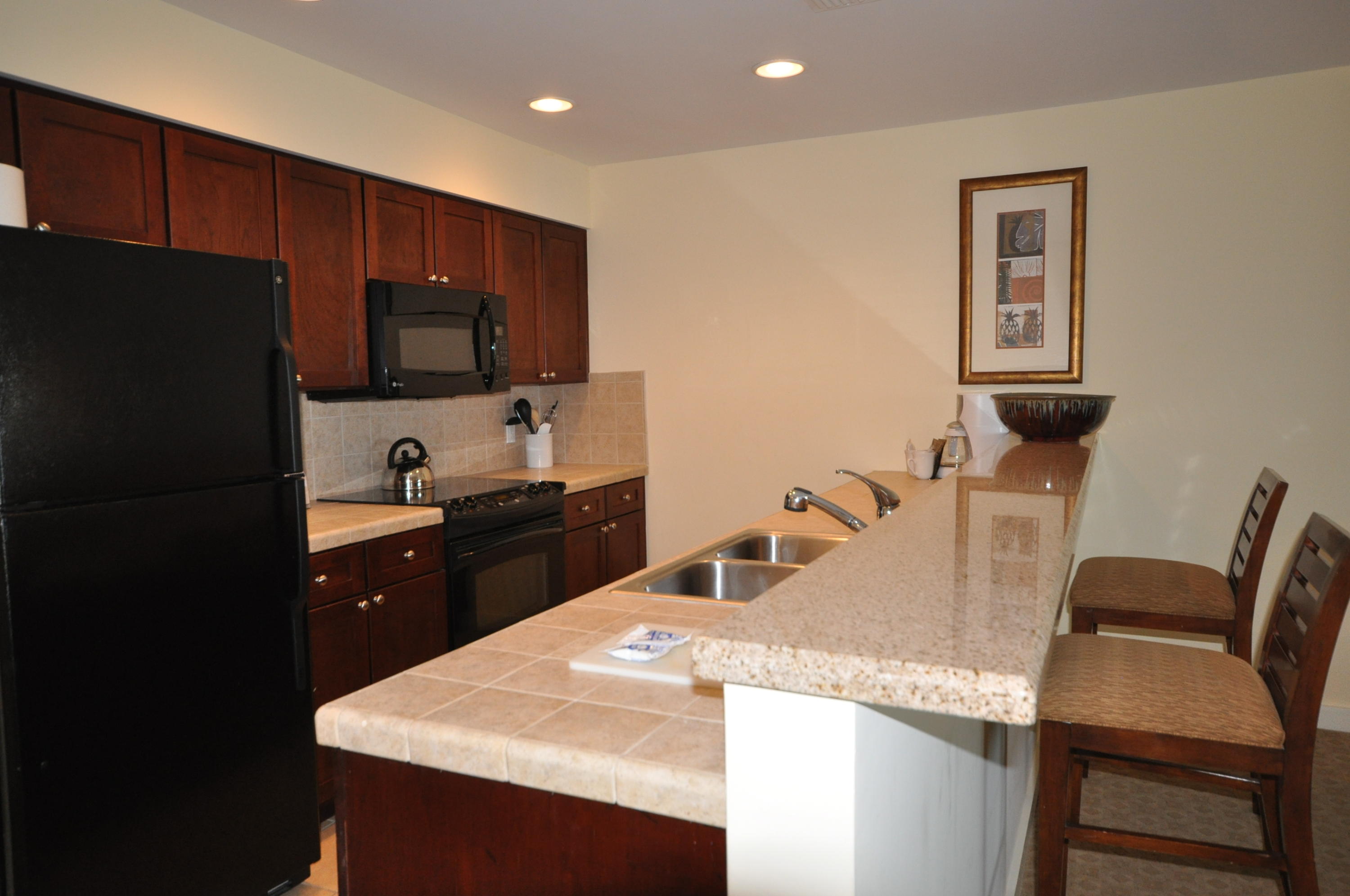 FULLY FURNISHED WITH ALL UTILITIES INCLUDED! Available for a 6 month lease. Luau offers an oasis getaway with a heated pool, relaxing waterfall, hot tub, gym, sundeck, and grilling area. Come see what all a Resort Community has to offer. Amenities available with the lease of this home (for a one-time, $150 administrative fee per lease term) are daily kayak, bike and boogie board rentals, daily tennis court time, fitness club access (with spa and steam rooms), access to the resorts four pools, and discounts on golf and beach set-ups. This is in addition to any amenities specific to this property's neighborhood and is an exclusive offering with this listing.