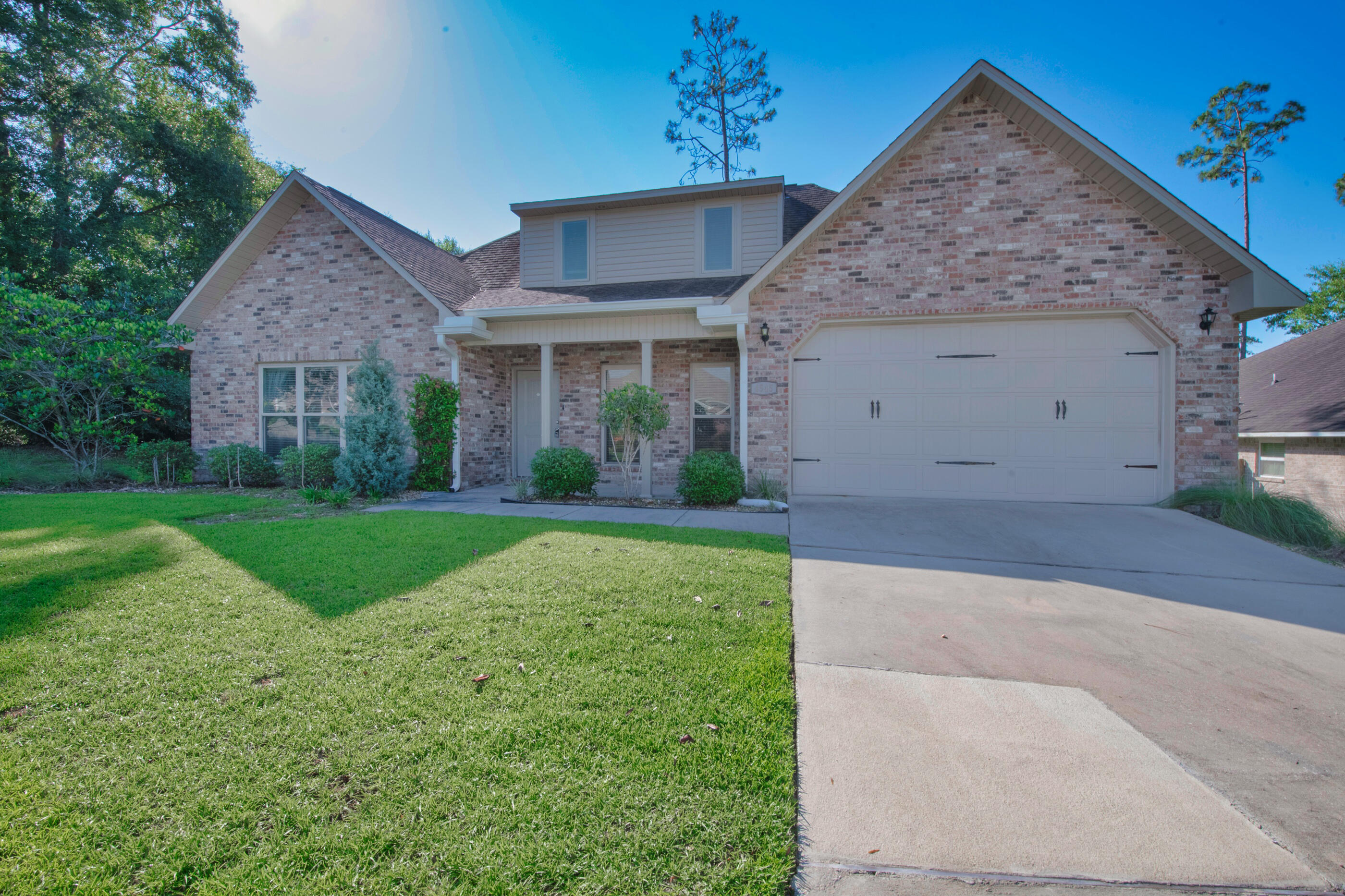 Welcome home to Kaitlyn's Preserve nestled on the south eastern edge of Crestview. Conveniently located for commutes to Duke Field, 7th Group, and Eglin AFB. As you approach your home you'll fall in love with its oversized lot and lush landscaping. As you walk in through your covered porch, you'll notice a large family room straight ahead and a sizable open dining area to the right. All of which includes plenty of natural light. Head to the right and you'll enter the kitchen. You'll love all the counter space and storage featuring granite counter-tops, med/dark wood cabinets, island, ss apps & pantry w/ additional under-stair storage. Continue through and head to the right and you find a full-bath, another sizable bedroom, and your laundry room. As you continue to the other side of the house, you'll pass the stairs to the second floor featuring 2 additional bedrooms and a full-bath. Keep going past your sliding glass doors and you'll notice a sizable patio and large fenced in back yard. Keep going back toward the front of the house and you'll enter the master suite. This master bedroom has plenty of room for your king size furniture, oversized windows, and plenty of storage with its large walk-in closet. Your large master bedroom includes a vanity station, dual sink, separate w/c & walk-in pebble-floor shower and tub. This listing won't last long! Schedule a showing today!