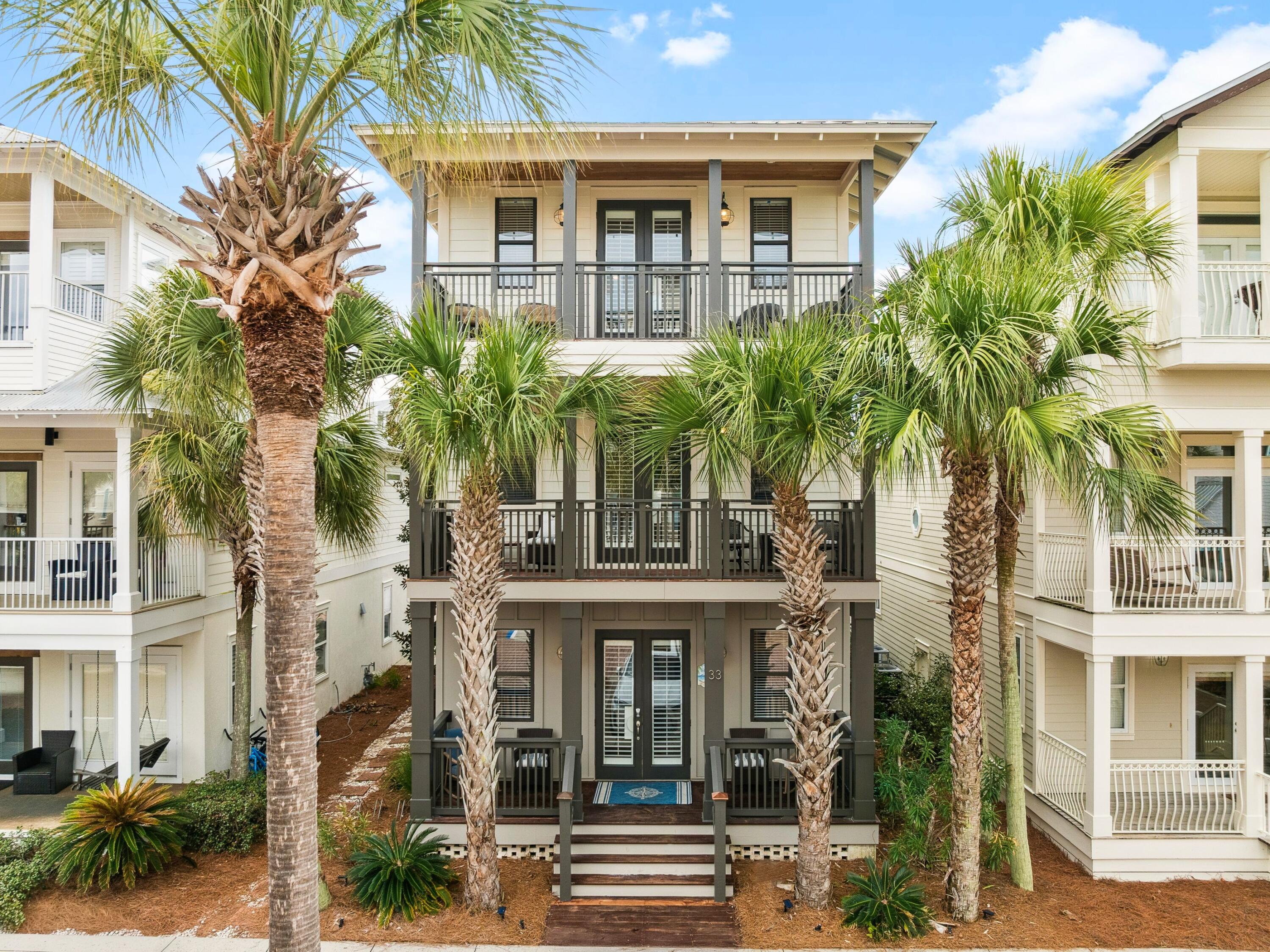 In the heart of Seacrest Beach along iconic Scenic Highway 30A, this meticulously renovated four-bedroom residence offers a refined take on coastal living just a five-minute walk from the gulf. Positioned near the north entrance for effortless access to 30A's boutiques and dining, the home enjoys a coveted setting across from one of the largest lagoon-style community pools in Florida while remaining pleasantly removed from the main roadway.

This reimagined 2,660-square-foot interior showcases warm wood and tile flooring, paneled ceilings and a serene palette inspired by sand and driftwood. The open-concept living area flows seamlessly into a stunning kitchen appointed with modern cabinetry, quartz countertops and high-end appliances. Soft ambient lighting enhances the inviting atmosphere, creating a space equally suited for spirited gatherings or relaxed evenings at home.

Thoughtfully designed to accommodate up to 12 guests, the layout balances privacy with generous communal areas. A first-floor bedroom with adjacent bath offers convenience and flexibility. The second level hosts two expansive suites and spa-style baths, including a soaking tub and glass-enclosed showers. On the third floor, an additional bedroom, loft with twin bunks and wet bar open to a balcony with sweeping community views. Expansive deck spaces extend from the main living area and upper-level bedrooms, providing ample room to enjoy coastal breezes.

Recent enhancements reflect meticulous ownership: a comprehensive front porch renovation in 2025, fresh interior and exterior paint in 2026, a new refrigerator in 2026, replaced roofing screws in 2025 and updated HVAC systems in 2021 and 2022. The result is a beautifully maintained home that is truly move-in ready.

Additional highlights include three rear driveway parking spaces, dining accommodations for 10, a gas grill, and access to the deeded beach via community tram. With close proximity to neighboring villages such as Rosemary and Alys Beaches, this property offers immediate access to acclaimed dining, upscale boutiques and scenic bike paths.

Ideal as a primary residence, coastal getaway or income-producing investment, this Seacrest Beach home pairs designer finishes with an exceptional location just moments from the gulf.