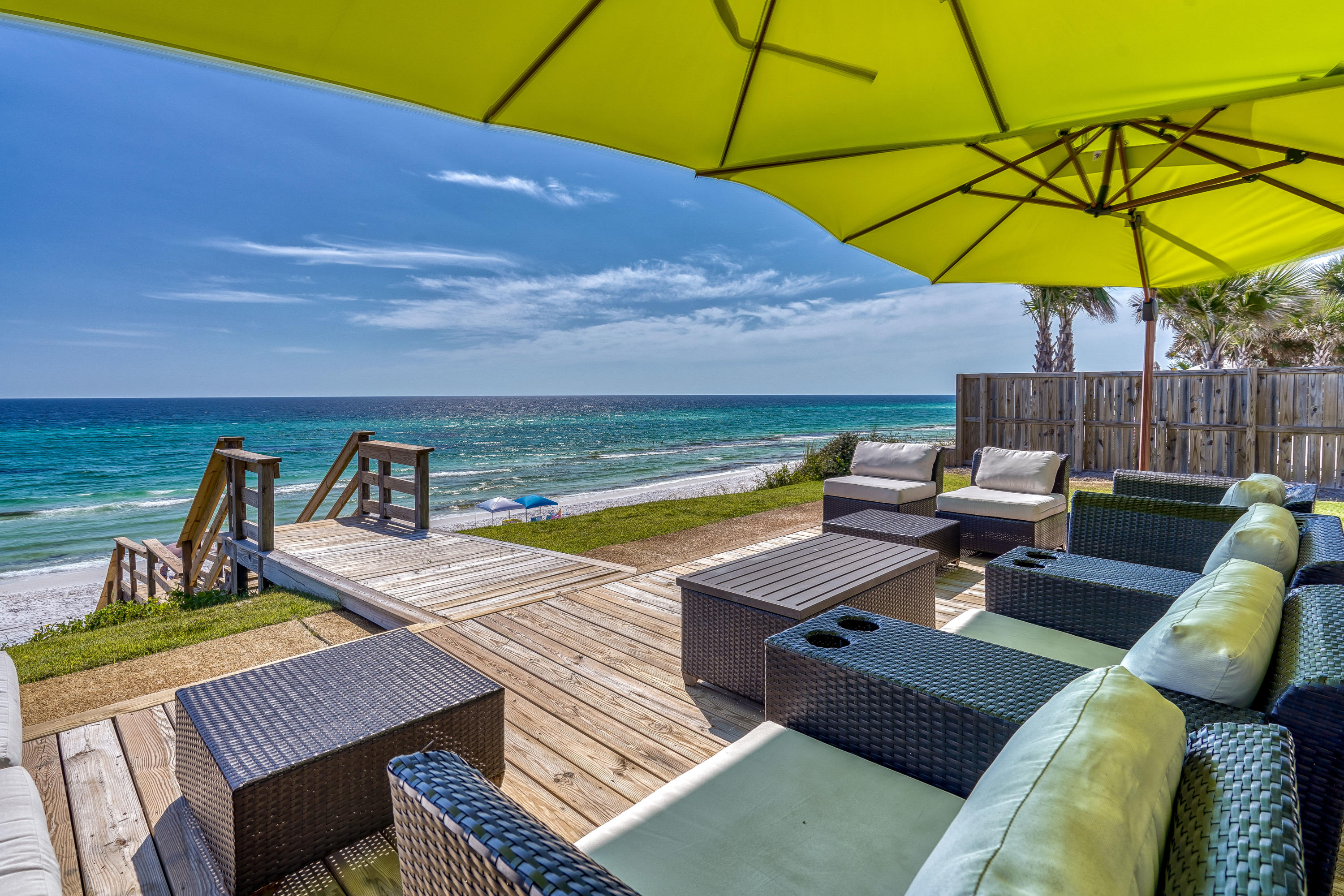 Rare Gulf-Front Opportunity on Scenic Highway 30A & walking distance to Seaside. Boasting 60 feet of direct Gulf frontage, this exceptional property is located along the highly sought-after stretch of 30A known as the ''Miracle Mile,'' perfectly positioned between Seaside and Seagrove Beach. Elevated on a natural bluff, the home enjoys commanding, panoramic views of the Gulf of Mexico and direct private beach access. This offering presents a unique opportunity to build a custom Gulf-front residence or enjoy the thoughtfully updated beach cottage currently in place. The residence features a light-filled, open living area oriented toward the water, creating an effortless connection between indoor living and the coastal landscape beyond. The kitchen is well-appointed with quartz  countertops, stainless-steel appliances
and casual seating, ideal for relaxed coastal living. The primary suite provides a private retreat, while additional guest bedrooms, including a generous bunk room, offer flexible accommodations for family and guests. Outdoor living takes center stage with a Gulf-front porch designed for taking in sunrise views, coastal breezes, and unforgettable sunsets. Ideally located near Highway 395, the 30A bike path, and Seaside's shops, dining, and year-round events, this property combines convenience with unmatched beachfront presence. Properties with this level of frontage, elevation, and location are increasingly rare, an outstanding opportunity to secure a premier Gulf-front homesite along Scenic Highway 30A.