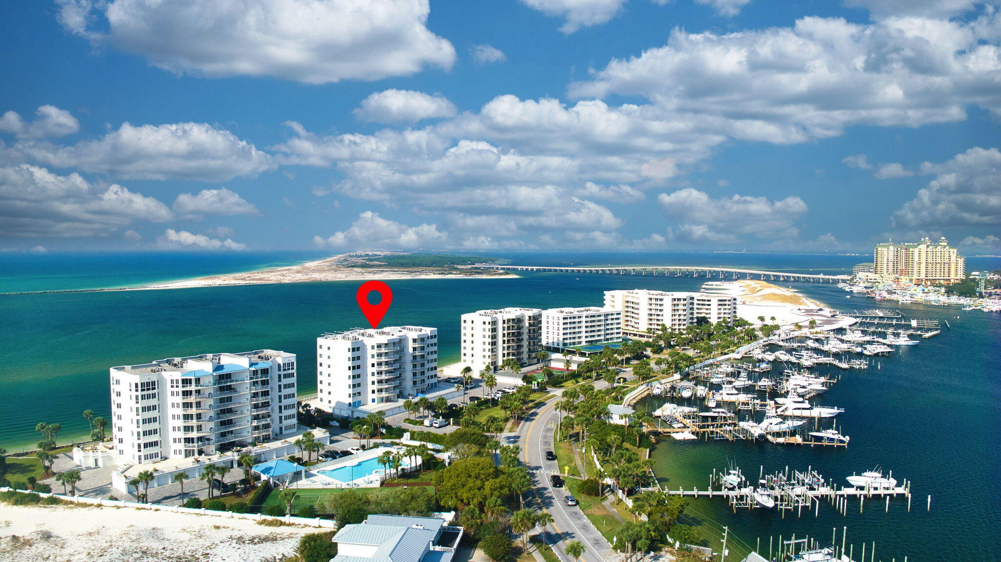 Located on the 4th floor of the prestigious Waterview Towers Yacht Club, this elegant residence blends refined design, exclusive privacy, and panoramic waterfront vistas. Enjoy sweeping views of the Gulf, Destin Harbor, and East Pass, where dolphins play, boats drift by, and the Thursday evening fireworks light up the sky—all from the comfort of your own home.

The expansive floorplan offers king-sized bedrooms, including two Gulf-front suites with private ensuite baths for ultimate in comfort and convenience. The open-concept living space is enhanced by travertine flooring throughout, crown moulding, an electric fireplace, and dual sliding glass doors that showcase the stunning coastal views. The chef's kitchen is appointed with Viking appliances, rich mahogany cabinetry, and granite countertops, while a wet bar with wine chiller and ice maker add to the entertaining appeal. Additional highlights include custom solid interior doors, glass-enclosed walk-in showers, remote-controlled shades, and two private balconies overlooking both the Gulf and Harbor.  

A rare advantage of this unit is the inclusion of two adjacent private garages and two large, climate-controlled storage rooms, offering generous space for vehicles and personal storage.

Residents enjoy security-controlled access to the gated entry, lobby, elevators and marina, as well as exclusive amenities: private beach access, a newly updated fitness center, swimming pool, spa, tennis court, and an elegant, recently renovated lobby. With only three residences per floor and a no short-term rental policy, Waterview Towers Yacht Club ensures a lifestyle defined by peace, privacy, and prestige.

And ... 
Deep water 15 x 35 boat slip #5 is optional. 
Kevlar storm/window protection is included.