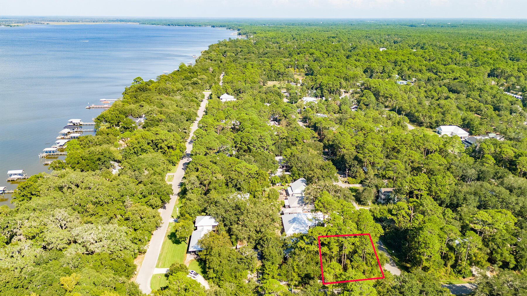 Priced to Sell is this 0.17 acre lot in the Daughettes of Point Washington.  Situated on a corner, you can build your next home amongst the mature trees already present.  This location is a favorite of locals due to its quiet streets, serene atmosphere, and no HOA.  Located entirely in Flood Zone X, so there's no flood insurance required or restrictions on building.  Located less than two blocks from the Choctawhatchee Bay and also directly north of Grayton Beach across Highway 98.  A multi-use paved recreation path has been completed that goes from Point Washington all the way to 30A - so you can enjoy the beach lifestyle without ever having to get in your car. Parcel lines are approximate, buyer to verify any/all information deemed important, a survey is available upon request.