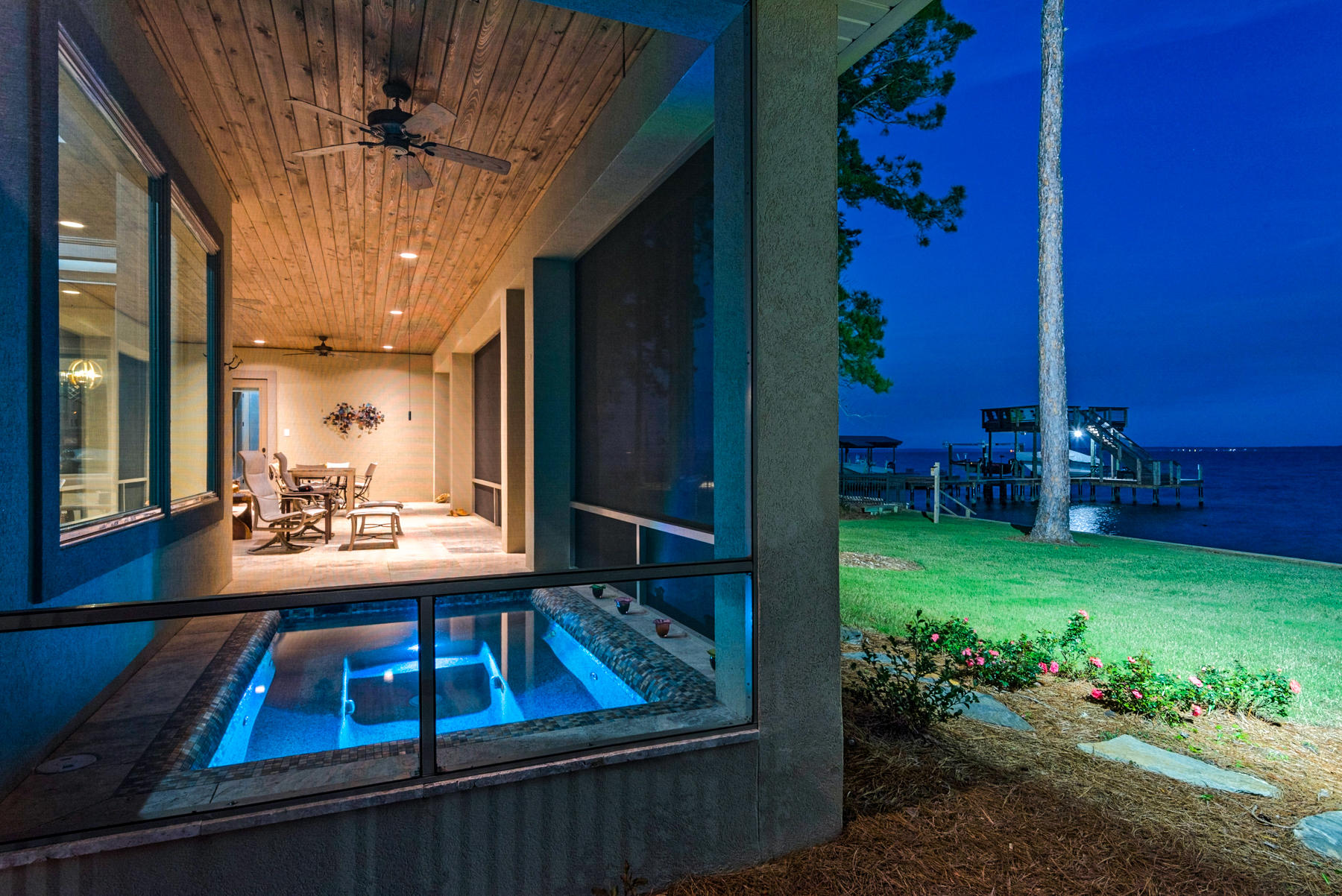 There is no reason to build when this ''almost new'', custom built home is ready to move in! No details were overlooked in the design and finishes of this home, completed in April 2018. All on one level, with an open, split bedroom floor plan, this home is situated for entertaining. The living room, with 12' ceiling, opens up with stacked sliding doors to the large screened porch which boasts a sunken spa, perfect for relaxing with amazing views! The designer kitchen has full sized separate refrigerator and freezer, an ice maker and gas range as well as beautiful granite and custom painted cabinets. Enjoy dining as you view the wildlife on the bay. There is a 3 car garage with wonderful storage built-ins and an RV parking pad wired with 50 amp power. 
The master bedroom overlooks the bay and the master bath has a large shower with 3 shower heads, 2 toilets and an oversized, custom built walk in closet, which includes vanity space. There is a full house dehumidifier and the home is wired for a generator.  Also a Ring door bell/alarm system was installed for safety. You will be conveniently located to all South Walton has to offer. Come view your piece of paradise on the bay!