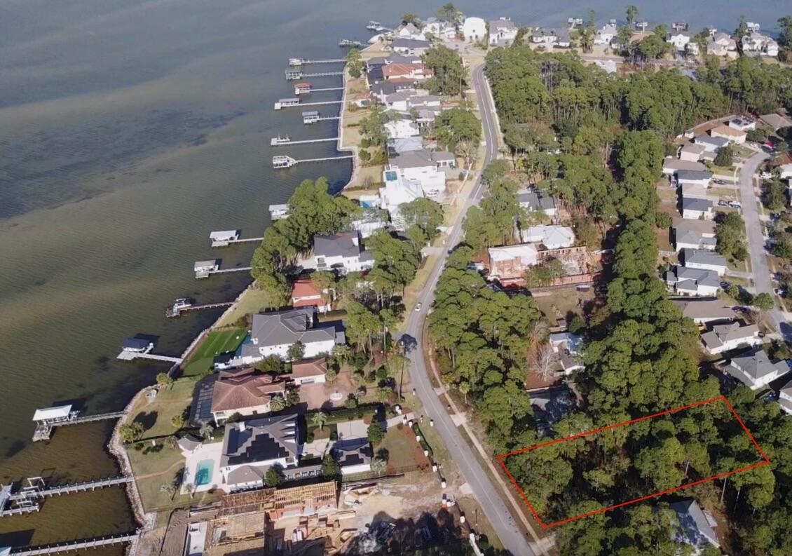 Build your dream coastal retreat on this exceptional homesite in Santa Rosa Beach with sunset views over the Choctawhatchee Bay! This 0.59 acre lot offers the rare combination of proximity to the water, privacy, and flexibility — with no HOA restrictions!

Located on a quiet street, this homesite is just steps from a nearby county park with pickleball courts, walking trails, and expansive green space for everyday enjoyment.

Whether you're creating a primary residence or a coastal getaway, this homesite delivers the perfect balance of natural beauty, freedom to build, and an unbeatable Santa Rosa Beach location!