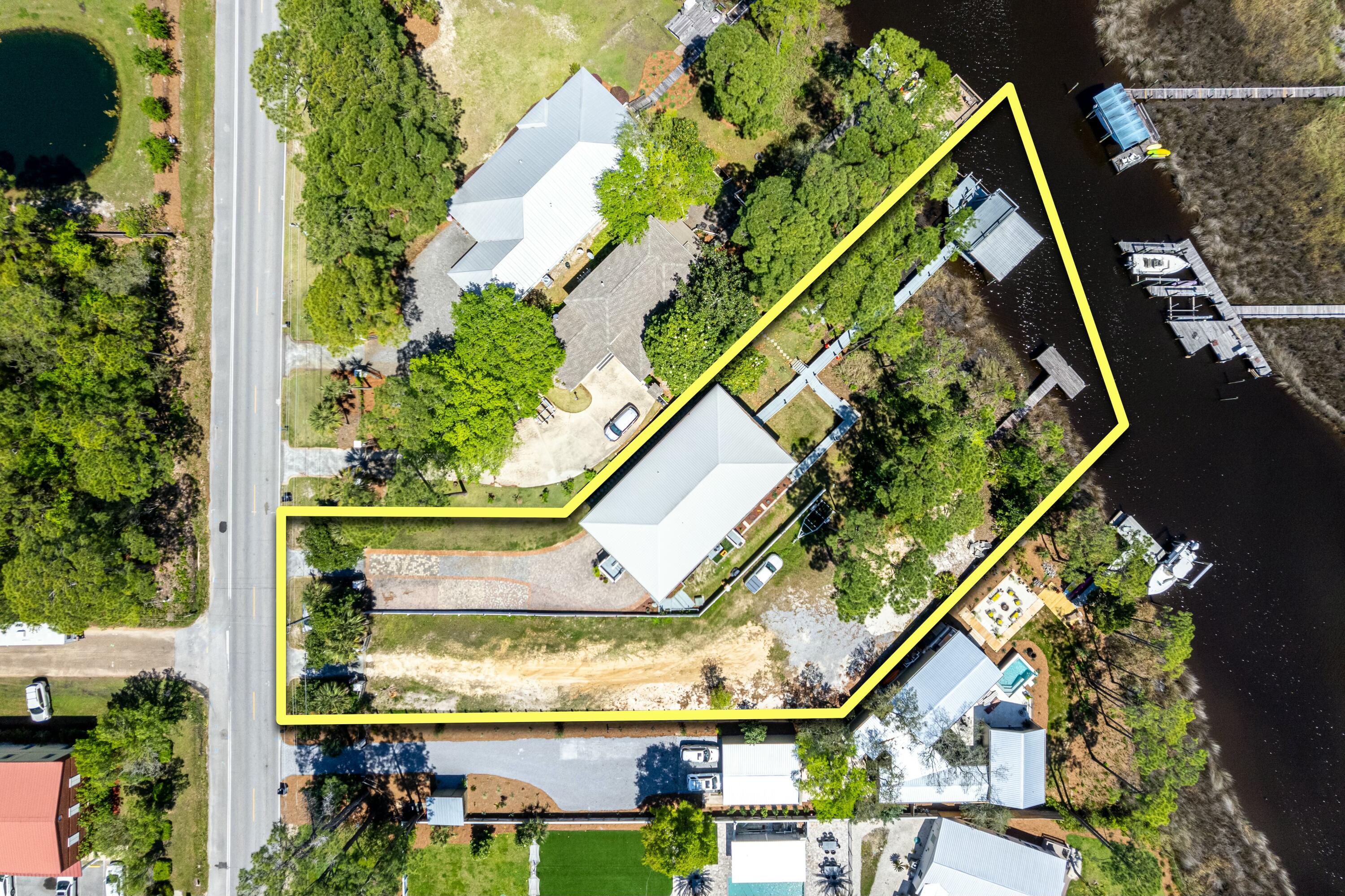 Welcome to your dream coastal retreat, nestled on the serene waters of Mack Bayou in beautiful Santa Rosa Beach, Florida. This exquisite double-lot waterfront estate spans nearly 1 acre of lush, private grounds with no HOA and boasts an impressive 136 feet of water frontage, delivering the perfect blend of luxury, space, location, and lifestyle. Tailored for boating enthusiasts, wildlife lovers, and anyone who craves the very best in coastal living.

Ideally situated just 2 minutes from Sacred Heart Hospital, 3 minutes from Grand Boulevard, and 5 minutes to the sugar-white sands of the Emerald Coast and Scenic Highway 30A, this location offers unparalleled access to everything you need. Grand Boulevard is a vibrant hub of fine dining, boutique shopping, entertainment, and grocery option s  all just around the corner. Whether it's a spontaneous beach day, upscale dinner, or a quick grocery run, convenience is never compromised.

This property is an absolute dream for boaters, with two private docks, including one with a 10,000 lb boat lift ideal for accommodating multiple vessels or enjoying the water from different vantage points. Launch directly into Mack Bayou and enjoy a quick ride to the open bay, where over 30 waterfront restaurants await your arrival by boat. And when it's time to unwind, Crab Island, the Emerald Coast's most iconic sandbar destination, is just a 30-minute boat ride away.

Nature lovers and anglers alike will appreciate the daily visits from dolphins, majestic osprey, and bald eagles soaring overhead. The surrounding waters teem with marine life, offering exceptional fishing for redfish, spotted trout, mangrove snapper, snook, sheepshead, black drum, and more. Whether casting a line from your dock or cruising to secret inshore spots, this is a sportsman's paradise.

Crafted for both luxury and functionality, this home features:
 Elevator for effortless access across multiple levels.
Oversized garage with ample space for vehicles, golf carts, and water toys.
Open-concept living areas with stunning water views
Expansive outdoor living spaces perfect for entertaining or quiet moments by the bayou.
High-end finishes and architectural details throughout.
From coffee at sunrise to cocktails at sunset, this home invites you to embrace every moment of waterfront living in comfort and style.

Set on nearly an acre of land across two lots, you'll enjoy exceptional privacy, generous outdoor space, and flexibility for future expansion. Whether you dream of adding a pool, guest house, lush gardens, or simply enjoying wide-open green space, this estate offers the rare luxury of room to grow and breathe.

This rare waterfront property is more than just a home it's a lifestyle. From world-class boating and fishing to beach days, fine dining, and shopping just minutes away, every day feels like a vacation. Whether you're seeking a primary residence, a coastal getaway, or a valuable investment, this Mack Bayou estate is a one-of-a-kind opportunity in one of Santa Rosa Beach's most sought-after locations.

Schedule your private showing today and come experience the unmatched beauty, space, and lifestyle this waterfront estate has to offer.