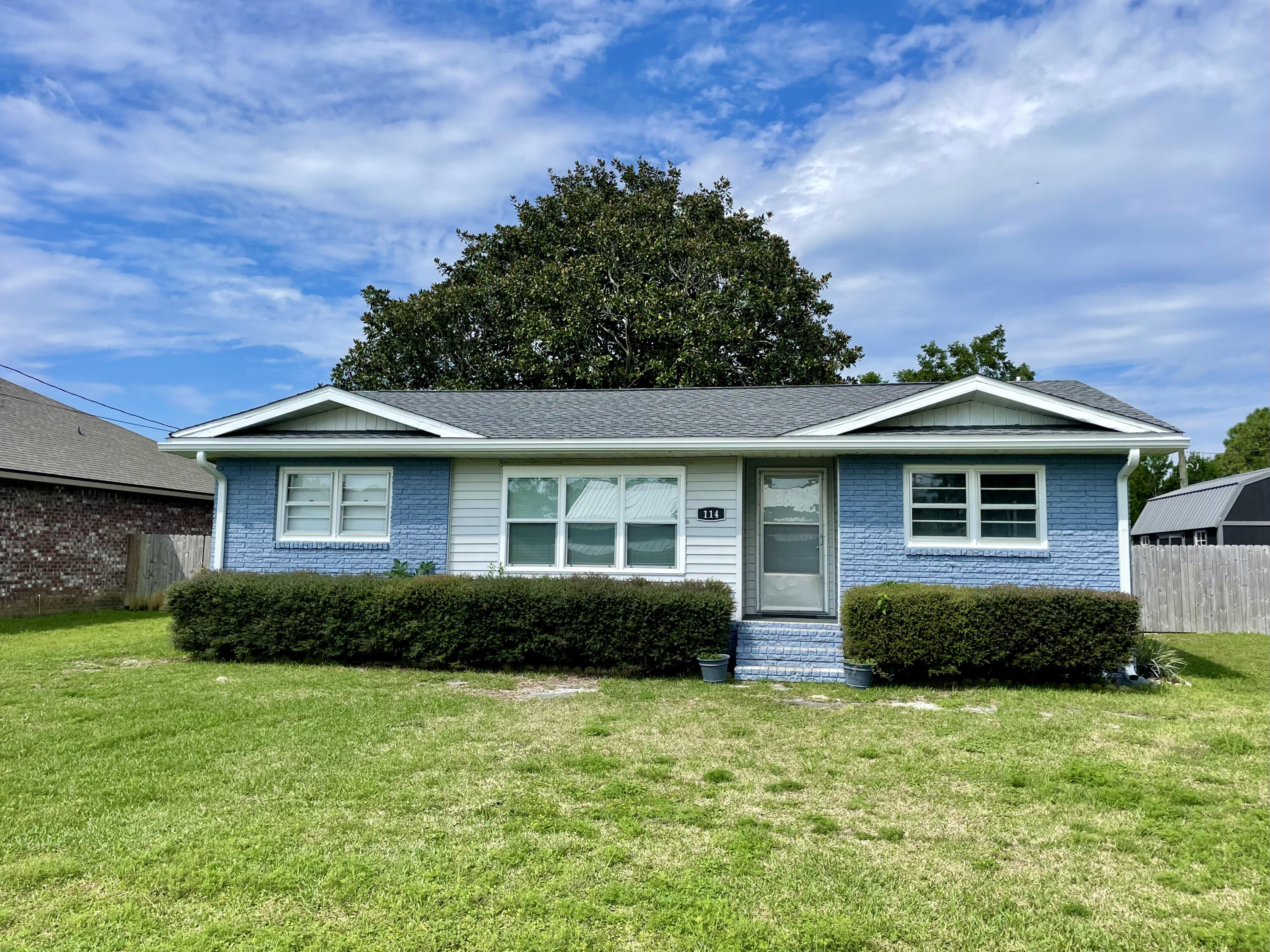 Cute Cottage-Style home on a big lot a few minutes from beautiful Navarre Beach! Freshly painted exterior and many updates throughout the home. Sunroom overlooks a large backyard with shade trees, fruit trees, a huge shed, gazebo, deck, aviary, and raised garden beds. Newer kitchen appliances and a washer/dryer convey with this property. Roof only three years young. Home is in an established neighborhood with a mixture of older and newer homes along with new construction. At this price point, it won't last long!