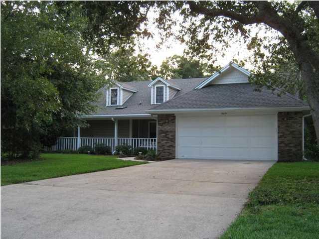 **AVAILABLE APRIL 15**You MUST SEE this lovely home on nearly a half acre lot, with a Wrap-Around Porch! Conveniently located in Bluewater Bay - AND in the Bluewater Elementary school zone! It has 4 Bedrooms, 3 Full Baths! Tile is in the kitchen and baths. The Master Bedroom and two additional bedrooms are located on the FIRST floor. There is an additional (HUGE!) 21x17 Bedroom upstairs - with its own bath! It can be used as a second Master, Mother-in-Law Suite, Guest Quarters or a Recreational Room! Gorgeous hardwood flooring is throughout the entry, living room and hall area. The Living Room has a vaulted ceiling and beautiful brick fireplace! Pictures are representative of the home, but not current.