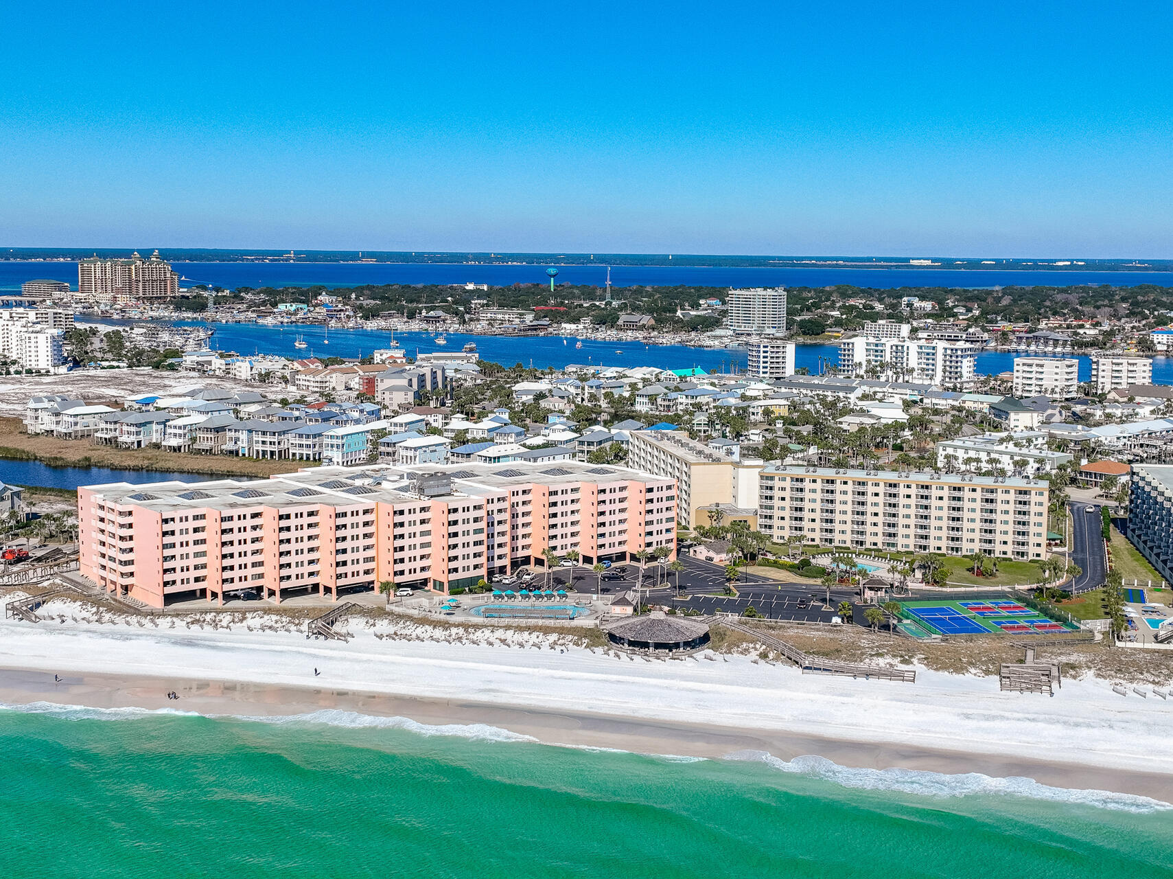 STUNNING UNOBSTRUCTED GULF VIEWS, GULF VIEW MASTER BR, RENOVATED KITCHEN & BATHS, & PASSED MILESTONE INSPECTION SET THIS TOP FLOOR CONDO APART FROM OTHERS.  Plus 57K 2023 ACTUAL INCOME BEFORE RENOVATIONS. Wake up to the sound of crashing waves & enjoy your morning coffee on your 108 SF covered patio while soaking in serene Gulf views. After a morning swim in the pool & a pickle ball match, spend the day on your private beach & wind your day down on your balcony enjoying the sunset. Wood look tile flooring, newly scraped ceilings & freshly painted walls/trim provide an updated look. You'll love the renovated kitchen w/NEW Quartz flat eating bar,  freshly painted cabinets & new backsplash & the 2 renovated baths w/new quartz vanity tops, mirrors & fixtures.  Upgraded high impact sliders & windows provide superior storm protection.  Gulf front pool & spa, beachside pavilion w/grills, tennis & pickle ball courts, fitness center & shuffle board courts offer everything you need for a relaxing or active vacation.  Great restaurants, shopping and golf are just a short drive away. Recently passed Milestone complex inspection, and "PAID FOR" complex renovations including new water cooling tank, elevators, balcony upgrades, atrium upgrades etc.. provide additional comfort & peace of mind. Act now as this fantastic Gulf front condo wan't last long.