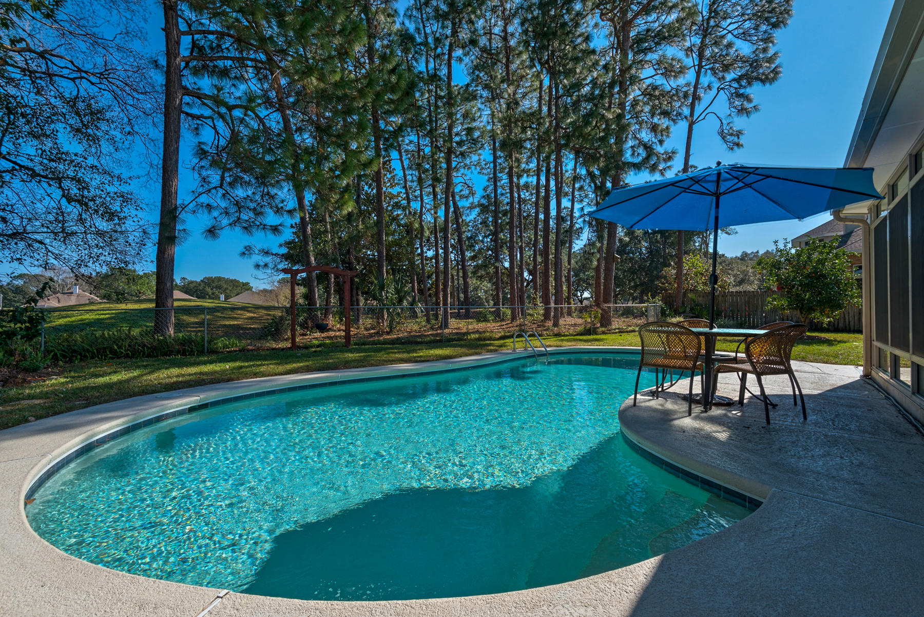 Luxurious living awaits in this three-bedroom home
Copy:
Indulge in the luxurious lifestyle of golf course living with this easy-care, move-in ready brick home. The layout is spacious and bursting with natural light. There are three bedrooms and three bathrooms including the master suite with a huge walk-in closet and an ensuite bath with a dual shower and twin sinks.
The kitchen is well-equipped with a suite of appliances including a dishwasher, plenty of storage and a breakfast bar. The kitchen is open to the casual meals area and there is also a formal dining room with hardwood floors, an arched window, glistening chandelier and coffered ceiling.
When it's time to relax, there is an open-plan lounge room with a soaring ceiling plus a sunroom with views over the yard. Step outside to your entertainer's oasis complete with a sparkling lagoon-style pool, a spa and lush lawns bordered by mature trees.

A quiet location between the fourth and fifth holes means you can enjoy lovely views of the soaring trees and gardens.

A note from the seller

What we love about 41 Lake Lorraine Circle

The ease, livability and flow from room to room. Each room can be private yet open and in view when desired. We feel we live and utilize the whole home effortlessly. The home temperature is easily controlled and dehumidified in the summer when needed. The tankless hot water heater provides hot showers to all in home and visitors  no waiting. Inside and all around house is easy clean up and maintenance.
The kitchen is located in the center of the home and a true gathering spot. TV viewing is more enjoyable with surround sound speakers. Rain can be a bother; however, in this home the sound is delightful splashing on the sunlights and roof of the Florida room. There is usually a visitor that wants to spend their visiting nights sleeping in the Florida room; and, who wouldn't want to wake up watching squirrels with their parkour abilities or a possible osprey, blue bird or heron.
Enjoyment of day or night swim  the night swim made special by underwater lights.
Our neighborhood streets have light traffic and therefore many residents walk, jog or bicycle. Some neighbors take late afternoon walks on the golf course. There's a gate in the back yard for entrance to the golf course.
New storm garage and front security doors for additional safety. Plus security of window storm shutters right inside the garage attic door opening. There is a security system activated but has only been set off by the home owners by accident.