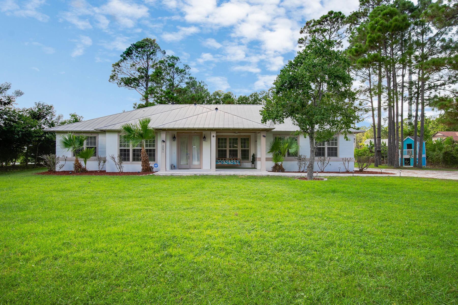 Beautifully renovated home ideally located just minutes from top-rated shopping, dining, and the world's most beautiful beaches. Completely updated and fully furnished from, this property features new tile flooring throughout, new stainless steel appliances, a metal roof, and custom finishes. The flexible floor plan includes a bonus room that can be used as an office, guest space, or creative studio. The master suite offers a cozy bay window bench.

 A large 35'L x 22'W workshop provides ample space for mechanics, woodworkers, or additional storage. The backyard includes a fun zip line for kids and plenty of room to entertain or relax outdoors. Fully furniMove-in ready and full of character, this home perfectly combines quality, comfort,
