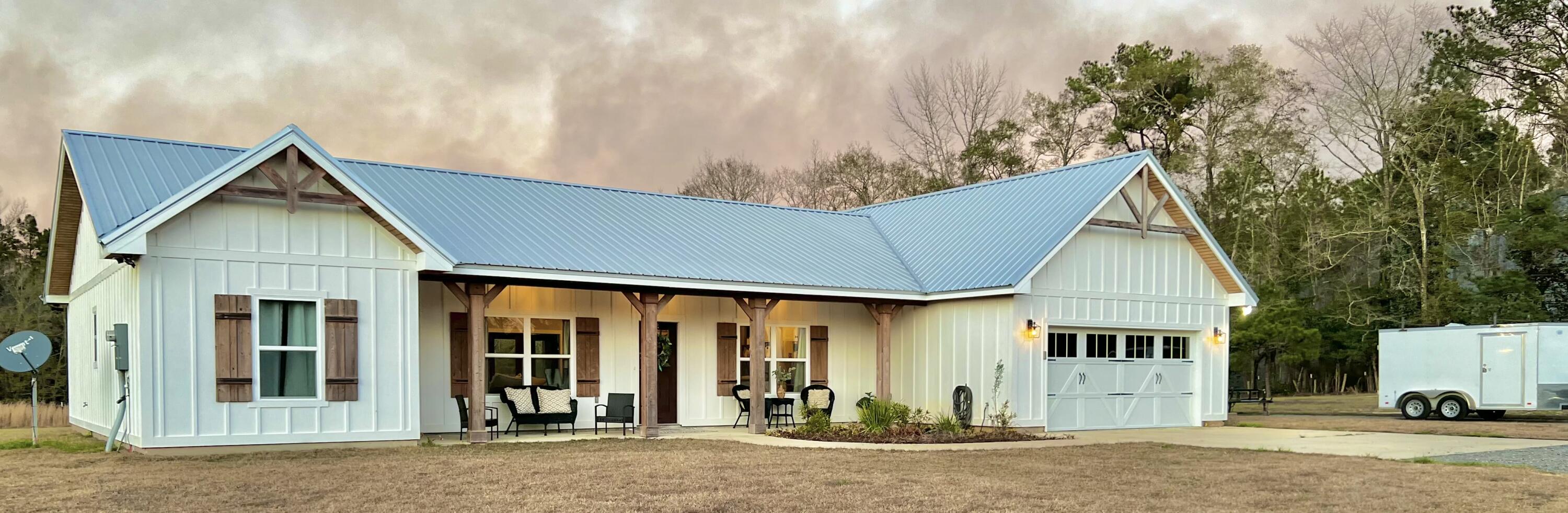 Gorgeous, nearly new construction (Built in 2020) home on 6.7 acres in the Baker community. 3 bedroom, 2 bath with a 2 car garage. Big porches on front and back of home. Wide-open floor plan with so much room for entertaining! Split floor plan with large master suite near laundry room. Master bath features a separate shower and tub, toilet room and dual sinks. Master closet is huge with custom built in shelving. High end appliances, stove/range, refrigerator, microwave and dishwasher convey. Kitchen features shaker style cabinets, beautiful granite, large island and a German schemer backsplash. The home has easy to clean vinyl wood plank flooring in living areas and carpet in bedrooms. With 6.7 acres of dry land, the possibilities are endless! Build a pool, shop, horse barn and more!