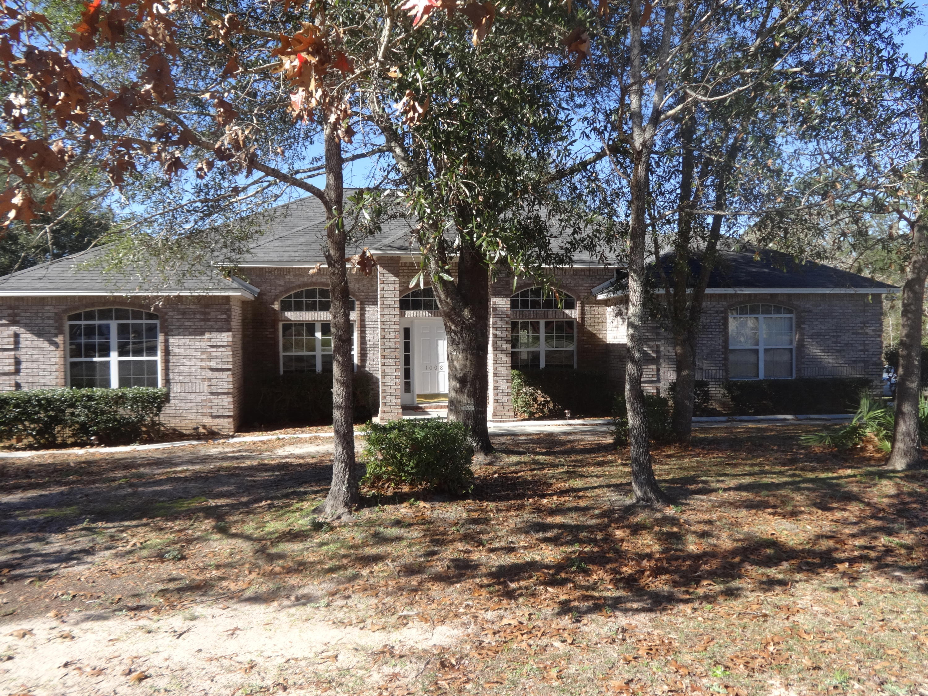 This is a 4bd / 3ba brick home with a split floor plan at the south end of Crestview. The living room has a fireplace and double doors that open to the screened back porch which leads to the deck. The master suite has additional doors that lead to the screened back porch; master bathroom has a double vanity with garden tub and separate shower, along with a spacious walk-in closet. The home has a new paint job, new carpet, new appliances and new kitchen countertops. No fridge.