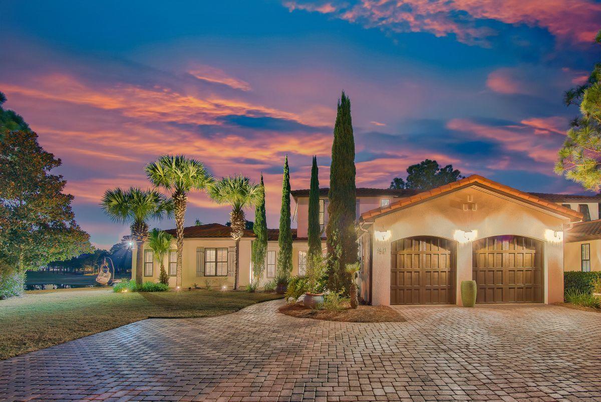 Elegant and private, this coastal lakefront home primely situated on an expansive lot at the end of a cul de sac features bright living areas, a tranquil outdoor oasis, and golf course views. High ceilings, travertine flooring, a soft palette, and an open floor plan make this home feel spacious and serene. Perfect for entertaining, highlights include a gourmet kitchen, island with breakfast bar, three dining areas, and wine cellar. Multiple sets of French doors open to a true backyard oasis allowing for seamless indoor/outdoor living. Enjoy pristine views of the lake and golf course, sizable private saltwater pool, two covered exterior living areas, two exterior fireplaces, and an outdoor kitchen with bar and grilling area. The expansive homesite provides plenty of privacy, spectacular views at sunset, and a fantastic view of the fireworks at Baytowne of Wharf. The master suite contains his and her baths, large walk-in closets, and views of the lake and golf course. One guest bedroom is located on the first floor, and two guest suites are upstairs. A brick paver driveway delivers plenty of parking including a side parking area and a two-car garage with a side entry golf cart garage door. 

6 seater golf cart conveys with the sale.

Extensive list of updates and renovations completed in 2020: freshly painted on the interior and exterior (including trim, doors, walls, ceilings, cabinets, and garage), all A/C ductwork in the home replaced, Wolf double oven and vent hood, U-Line icemaker, first floor HVAC unit, replaced the saltwater system, pool heater, and pool pump motor, and LED recessed lights throughout entire home to name just a few! Entire list of recent updates / renovations is in the Documents tab. 

Located in a non-rental neighborhood within the gates of the Sandestin Golf and Beach Resort, enjoy access to exquisite amenities resort life provides, including four golf courses, tennis courts, a marina, beautiful beaches, and shopping and dining at the Village of Baytowne Wharf, Grand Boulevard, and the Market Shops.

2021 Association Fees include $100.00 per month to Genoa Homeowners Association and $383.93 per quarter to Sandestin Owners Association for a combined total of $227.98 per month.