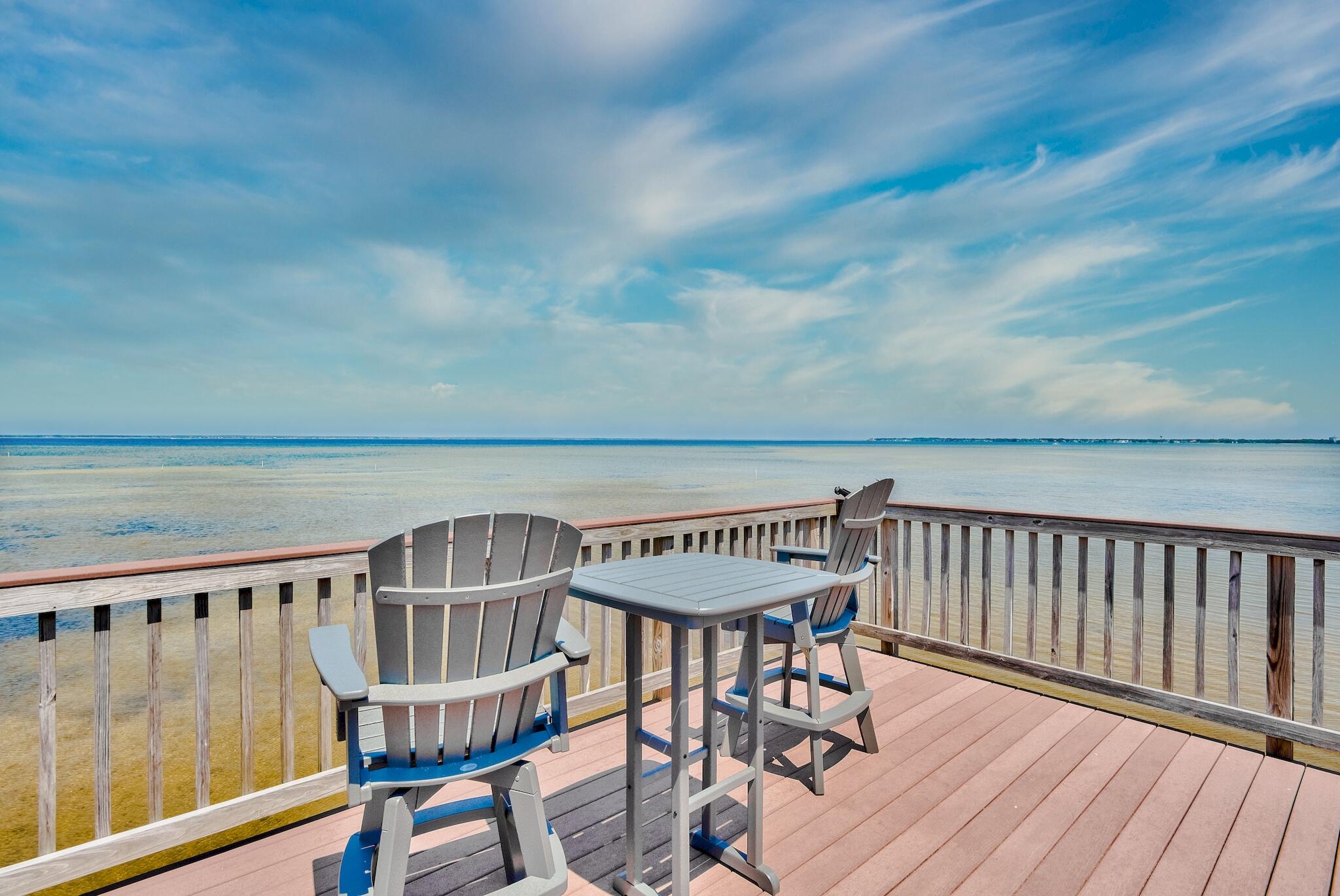 ***PROPERTY UNDER CONTRACT WITH CONTINGENCIES.  ACCEPTING BACK UP OFFERS***
Rare opportunity to own a beautiful home on the Choctawhatchee Bay in Miramar Beach with NO HOA fees.  A private oasis of serenity can be yours living on the Bay, with spectacular, breath-taking sunsets, listening to the soft waves, watching the dolphins go by, enjoying boating, fishing and many outdoor water activities.
This home is located on a no outlet, friendly neighborhood street, has stunning curb appeal and has been meticulously maintained, in addition to $256K in upgrades. Upon entering through the tall wooden doors, you are greeted by a 24ft foyer ceiling and travertine floors throughout the first level.  Notable features include Bayfront master bedroom with a grand en-suite bathroom, double granite vanities, dual shower & jacuzzi, large walk in closet, tray ceiling, and direct access to the screened in pool.  Also, a spacious living and dining room with a gas fireplace that lead to the outdoor kitchen, architectural details like crown molding, archways, and 12 ft ceilings.  Kitchen features granite counter tops, recessed and upper cabinet lighting, stainless steel appliances, plus an abundance of cabinetry.  An additional large bedroom is located on the first level, which could be utilized for guests, children, home office or gym.  
Second level features hard wood floors and carpeted bedrooms.  Three additional, spacious bedrooms, one could be a second master or in-law suite.  All three bedrooms include en-suite bathrooms and large closets with direct access to the 40 ft travertine tiled balcony with stunning tropical views. Also, there is a spacious media room with a kitchenette over looking the pool and bay, a cozy entertaining area for family and guests with beautiful sunset views. 
This is a Must See property and will not last due to the limited availability of Bay front homes.  This incredible home is just five minutes from the prestine white beaches, easily accessible by golf cart or bike through the many public beach access points on Scenic Hwy.  Legion park is 2 minutes away and offers a boat and jet ski launch, basket ball court, volley ball, and playground overlooking the Bay.  There are many excellent dining, shopping, and entertainment venues within minutes.  This is an amazing, limited opportunity for luxurious living, it will not last.