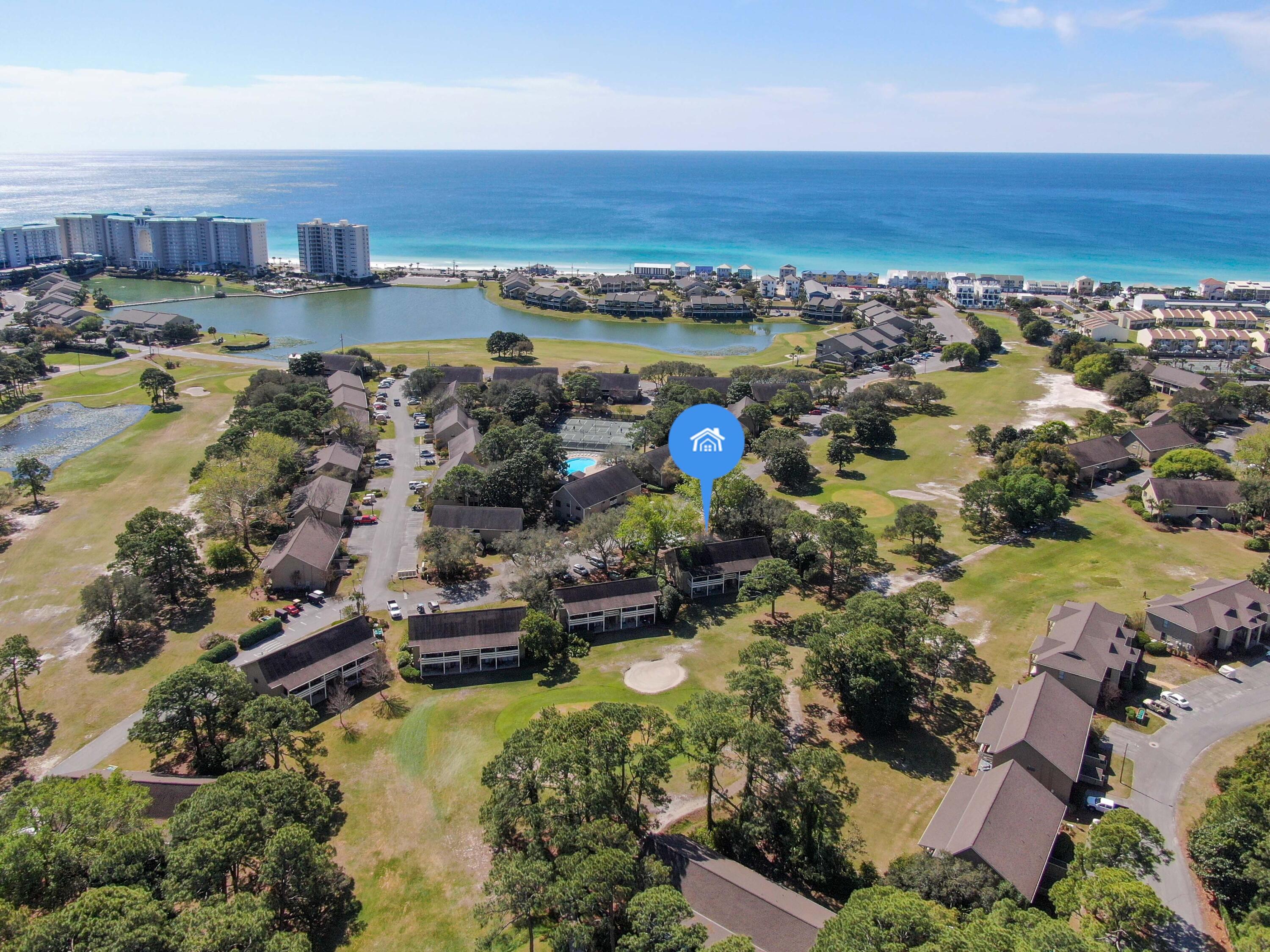 This light and bright two bedroom two bathroom golf side villa is a perfect combination of beach, adventure, and nature all in one!  Located on the 300+ acre Seascape Resort with an 18 hole golf course, pools, tennis and pickleball courts, restaurants and bars, and 2000 ft of privately owned white sand beach!   This rare gem is being sold by the original owners and has never been a rental.   It is conveniently located on the 1st floor for easy access and no stairs.  Newly painted with brand new stainless steel appliances and granite countertops.  HVAC replaced in 2020, water heater in 2019.   This spacious villa is just a short walk or golf cart ride to the beach.    It is vacation rental friendly and would make a great investment property just in time for the approaching summer season. This condo comes fully furnished and ready for its next investor, vacation home owner, or someone looking to live full time and enjoy the lifestyle at Seascape Resort.