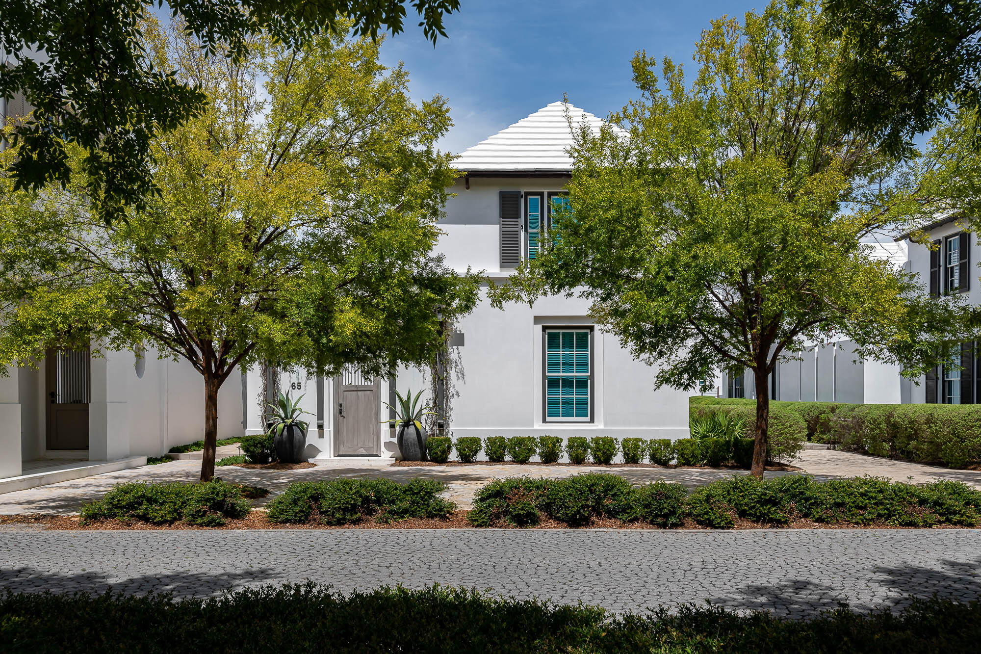 Strategically located in the heart of Alys Beach, 65 N. Charles offers accessibility to all points of interest.  A short distance to the Gulf Green beach access, Beach Club, and Town Center, this property lends itself to a premium location.  Urban Grace Interiors tastefully created a masterpiece with décor & furnishings to compliment the Eric Watson, AIA, design of this 4 bedroom 4 ½ bath home.This property is freestanding, open on all elevations surrounded by beautifully landscaped pedestrian paths adding to the aesthetic appeal of the home.Upon entering the home, you will find open, vaulted ceilings with custom beams giving depth and beauty throughout the dining, kitchen, and living rooms honed in venetian plaster with shadow casting from natural light.  The continuous spaces of dining,  kitchen, and living is open for interaction having banks of French doors with views of the courtyard & heated pool. Entertaining is desired with the home's generous kitchen equipped with Thermador appliances, accentuated by marble stonework or by way of the covered outdoor loggia with summer kitchen with sectional seating & television steps from the courtyard's pool & fountain.  If desired, retreat to the living room to warm by the fireplace. This well-appointed, professionally designed home offers two bedrooms on the main level and two on the 2nd having primary bedrooms on each that is unique to Alys.  Each bedroom hosts en suite bathrooms with generous closets.  Each bedroom yields its own character of décor and furnishings custom to each. The en suite bathrooms vary in complimentary stone works of marble & Dominican Shellstone. The 2nd level west bedroom opens to a lovely roof terrace looking upon the courtyard below and for viewing of the architectural roof tops Alys is renowned for. This home has an office for those needing to conduct business.  65 N. Charles is a long-awaited property to now be introduced to the market.
