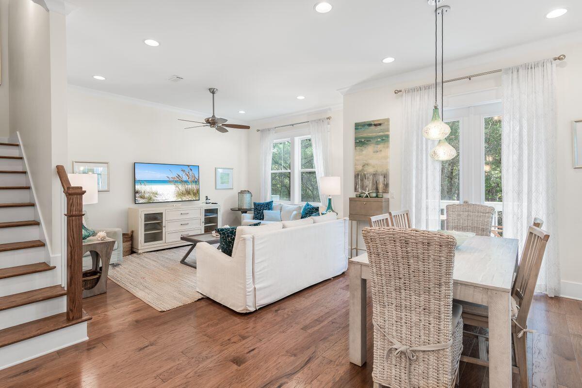 Welcome to the wonderful lifestyle village of Prominence. Whether a permanent residence or vacation destination this community is noted for embracing the serene exclusive experience of 30a. Located in Phase 1, this clever Cozumel floor plan features a two car garage, open concept living, dining, and kitchen on the first floor. The kitchen is furnished with GE appliances, subway tile backsplash, and focal GE wall-mounted vent hood. There is also a laundry room with additional storage under the stairs and half bath. Moving to the 2nd floor, three bedrooms greet you with warm hardwood floors. The Master features a tray ceiling and large on-suite bathroom with beautiful tile floors, double vanity with granite top, and walk-in shower. Best of all, this home nestles against the state park insuring the peacefulness and beauty coveted by so many within this community. The Prominence community straddles both the north and south side of Scenic 30A with a center called The Hub that serves as the heart of town. The Hub encompasses three acres with over 30,000 square feet of space that includes specialty shops, restaurants, bistro bars, and other delightful diversions. A resort styled Prominence Pool House sits beside a sparkling 5,000 square foot private community swimming pool.