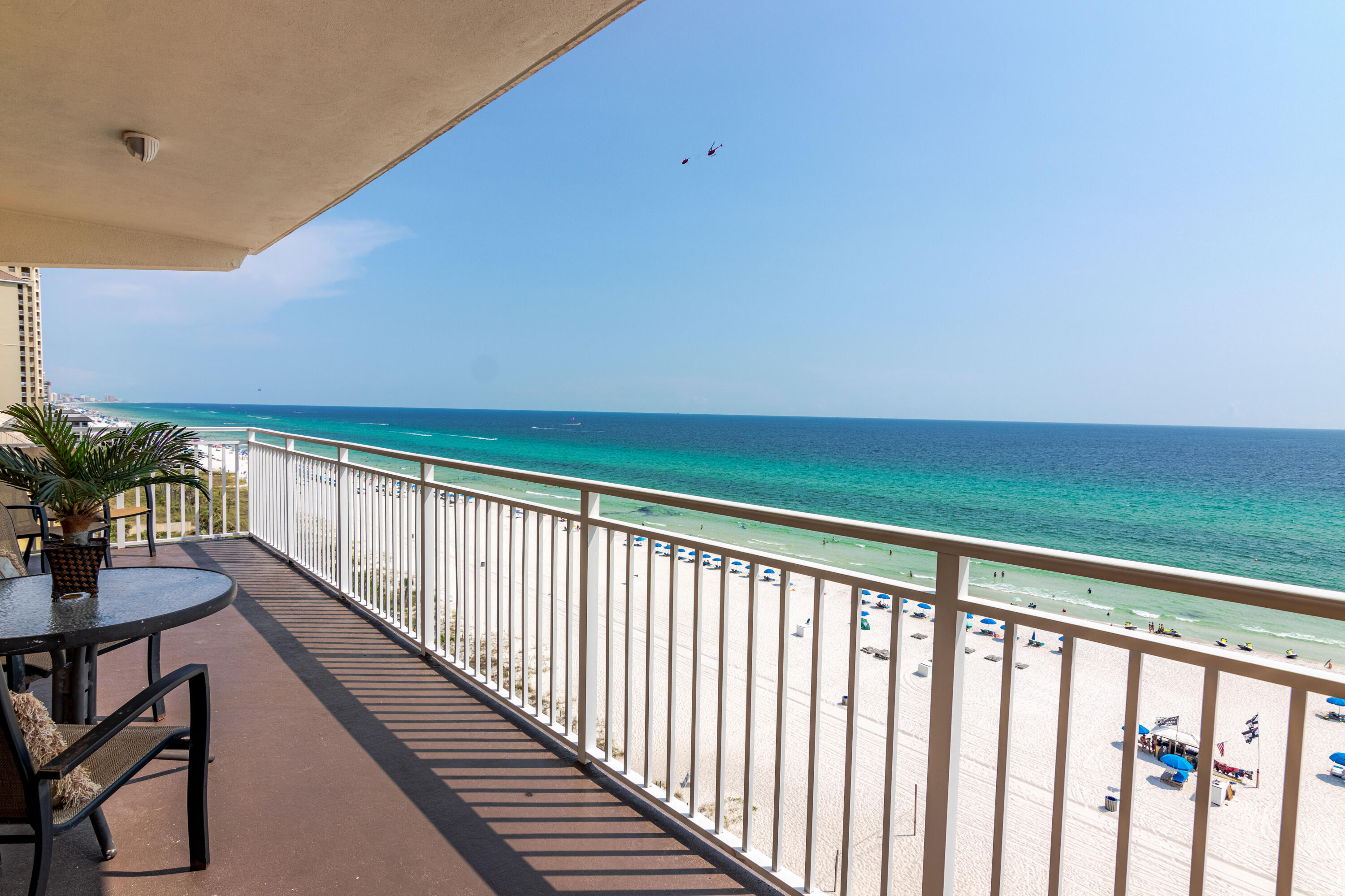 Impeccably decorated and appointed condo in  the heart of Panama City Beach with sweeping gulf views on the much desired 5th floor of Sterling Reef. This condo is spacious and airy with side windows that only an end unit can provide. Beautiful kitchen with island and adjoining plushly furnished living room with unobstructed gulf views from the kitchen, dining and living rooms. You won't see another bathroom like this condo has anywhere on the beach. Oversized custom-tiled shower and custom bowl top vanities are simply stunning. The large 7 by 27 balcony deck overlooks the gulf and has phenomenal views. Beachside master suite opens up to the balcony as well. Beachfront pool and covered garage parking are sure to please. Close to restaurants, shops, marinas and restaurants. Come see today!