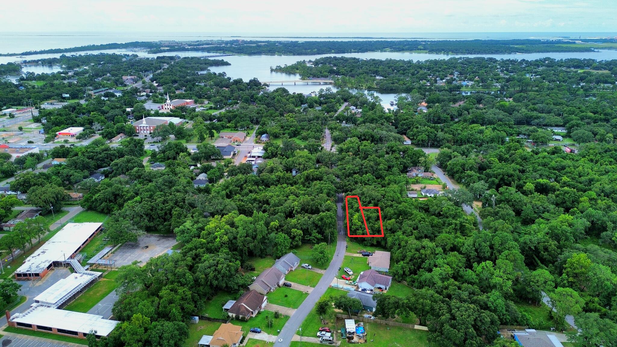 Motivated Seller!! BRING ALL OFFERS!! Ask about Seller paying closing costs! Two adjoining parcels totaling .3416 acres are now available just minutes from the front gate of NAS Pensacola! Located right off Gulf Beach Highway on a partially developed residential street, these lots offer easy access to beaches, shopping, dining, and more. Zoned MDR (Medium Density Residential), this property offers flexibility for a variety of residential uses. The land is not cleared, and tap fees have not been paid—giving you a blank canvas to develop exactly as you wish. Whether you're ready to build your forever home or invest in Pensacola's growing west side, this location combines accessibility with long-term potential.